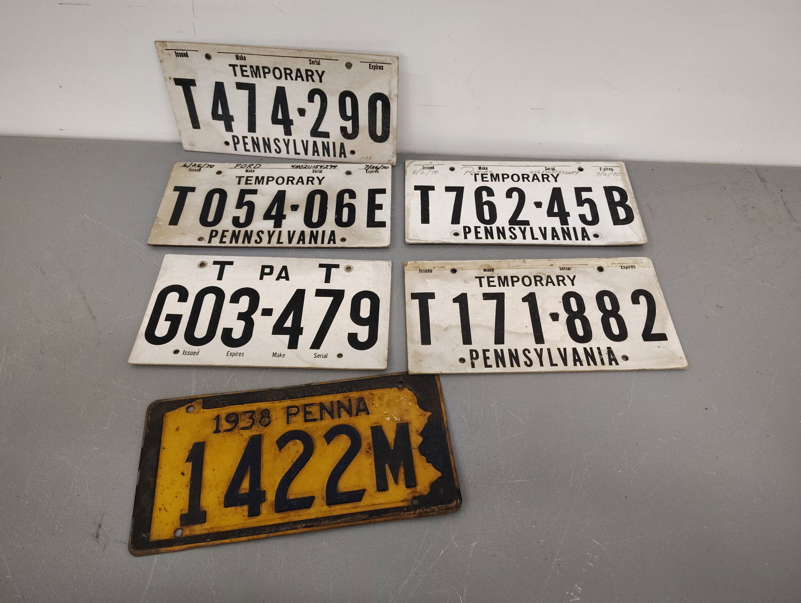 license plate: 1938 5 temporary plates cardboard