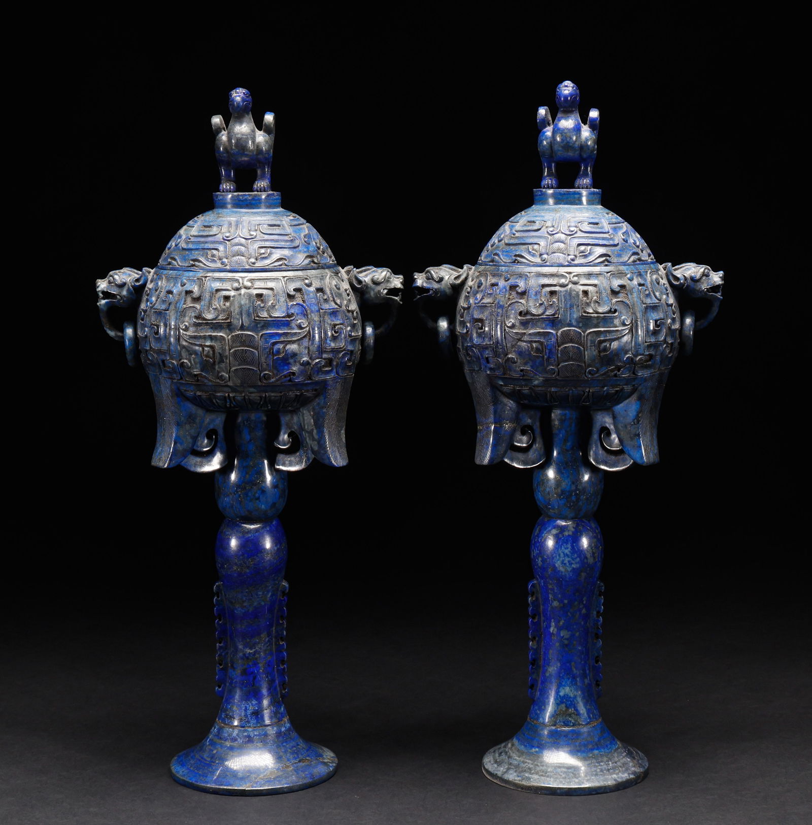 A pair of Qing Dynasty lapis lazuli high footed furnaces: Height: 40cm, Width: 17.5cm, Weight: 4043g This is a pair of ritual vessels (incense burners) made of lapis lazuli. The main body is carved from lapis lazuli (a gem-quality mineral, characterized by d