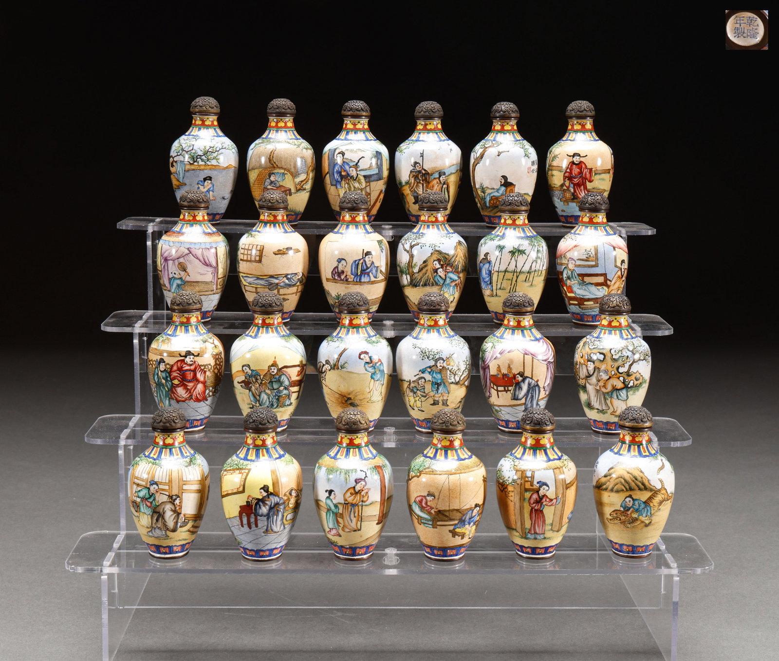 A set of twenty-four filial piety snuff bottles made of copper from the Qing Dynasty: This is a set of 24 copper body painted enamel (foreign porcelain) snuff bottles, corresponding to the traditional story of "Twenty Four Filial Piety". The bottom can be seen in the upper right corner