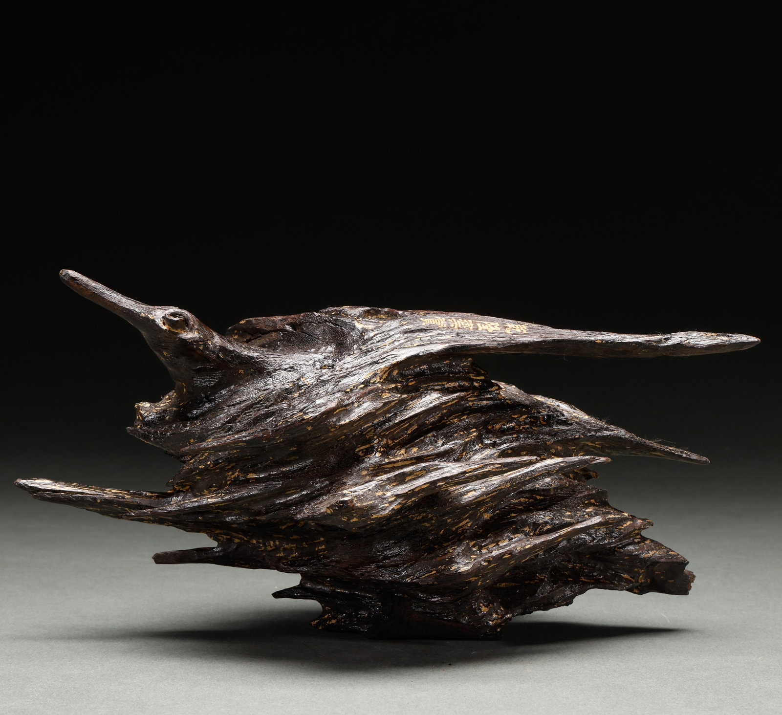 Qing Dynasty agarwood ornaments: This is a natural shaped ornament made of high oil agarwood, with gold inscriptions on the wooden body. It belongs to the elegant antique agarwood ornaments of the study.Height: 15cm, Width: 26cm, Wei