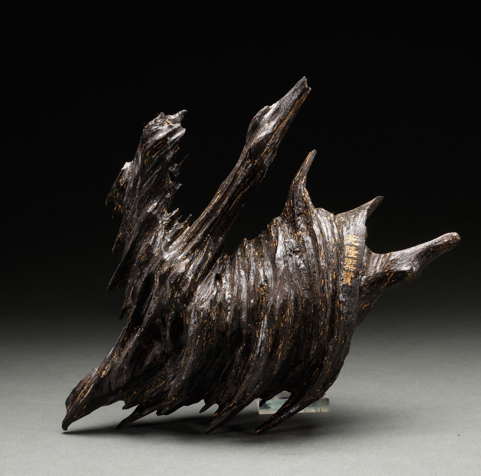 Qing Dynasty agarwood ornaments: This is a natural shaped ornament made of high oil agarwood, with gold inscriptions on the wooden body. It belongs to the elegant antique agarwood ornaments of the study.Height: 26cm, Width: 32cm, Wei