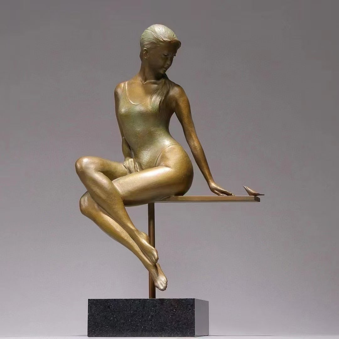 The bronze statue of a young girl by Guanghong from Daido Temple, Japan: A copper gilded sculpture of a figure, with a modern sitting posture and a serene and natural demeanor. The lines are smooth and elegant, showcasing the proportion and dynamic beauty of the human body