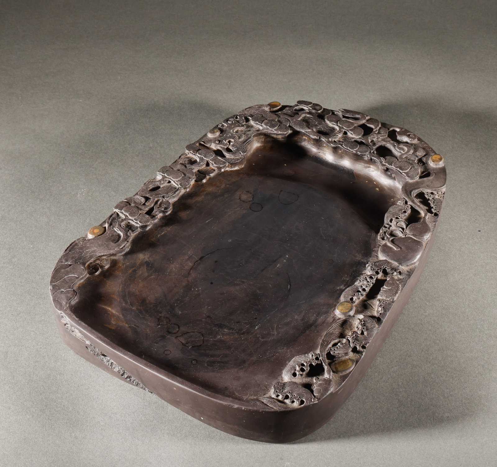 Large sized inkstone square: Large hollowed out pine longevity pattern natural stone eye end inkstoneSpecification: 33cm in length and 24.5cm in width, weighing 6370g; Thick and solid inkstone, with multiple layers of carved pine