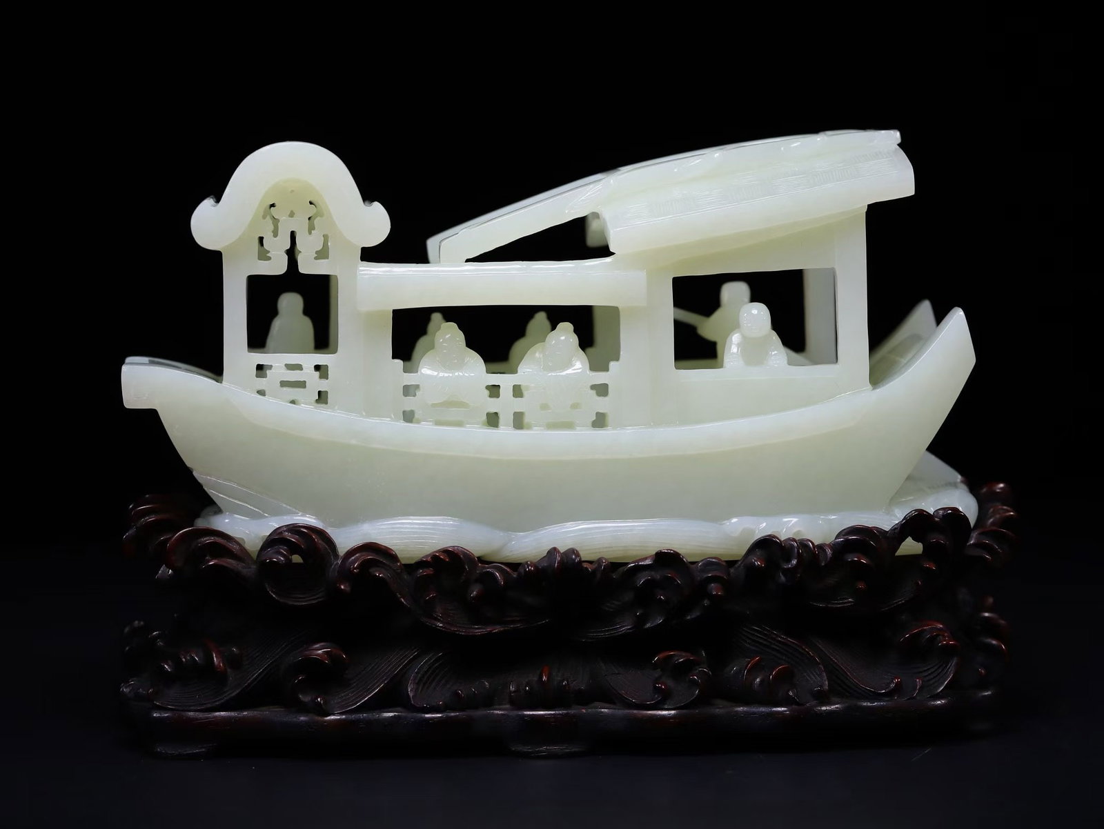 Hotan Jade figure story pattern boat in the Qing Dynasty: Hetian white jade hollowed out deep carved character boat decorationSpecification: 8.5cm in height to 16cm in length, weighing 770g; the entire piece is made of white jade material with three-dimensio