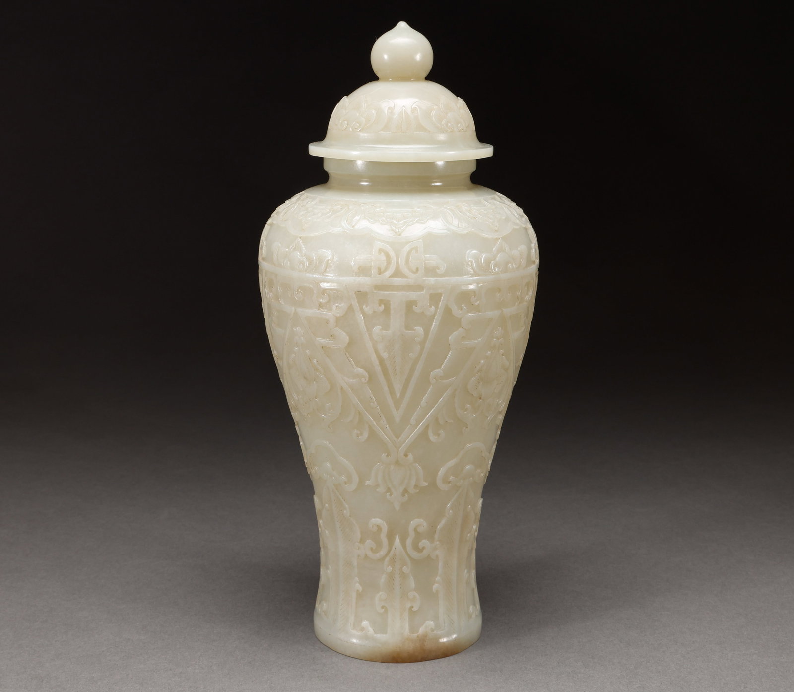 Qing Dynasty Hotan Jade General Jar: Hetian white jade relief with Baoxiang pattern and covered jade bottleSpecification: 26cm in height and 12cm in width, weighing 554g. Made of high-quality white jade with a warm and smooth texture, th