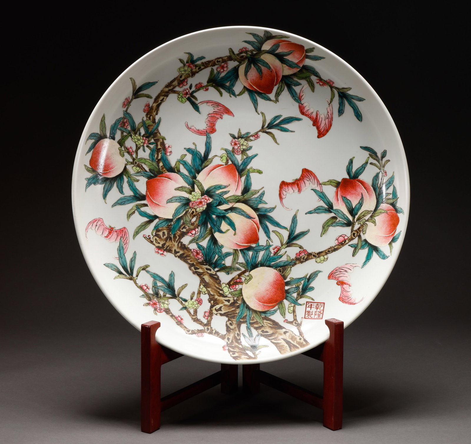 Qing Dynasty Pink Peach Pattern Plate: Qianlong Year Pink Nine Peaches and Five Blessings Grand Appreciation PlateThe specification is 12 cm in height and 62cm in diameter. The dial is decorated with green branches and peach blossoms, surr
