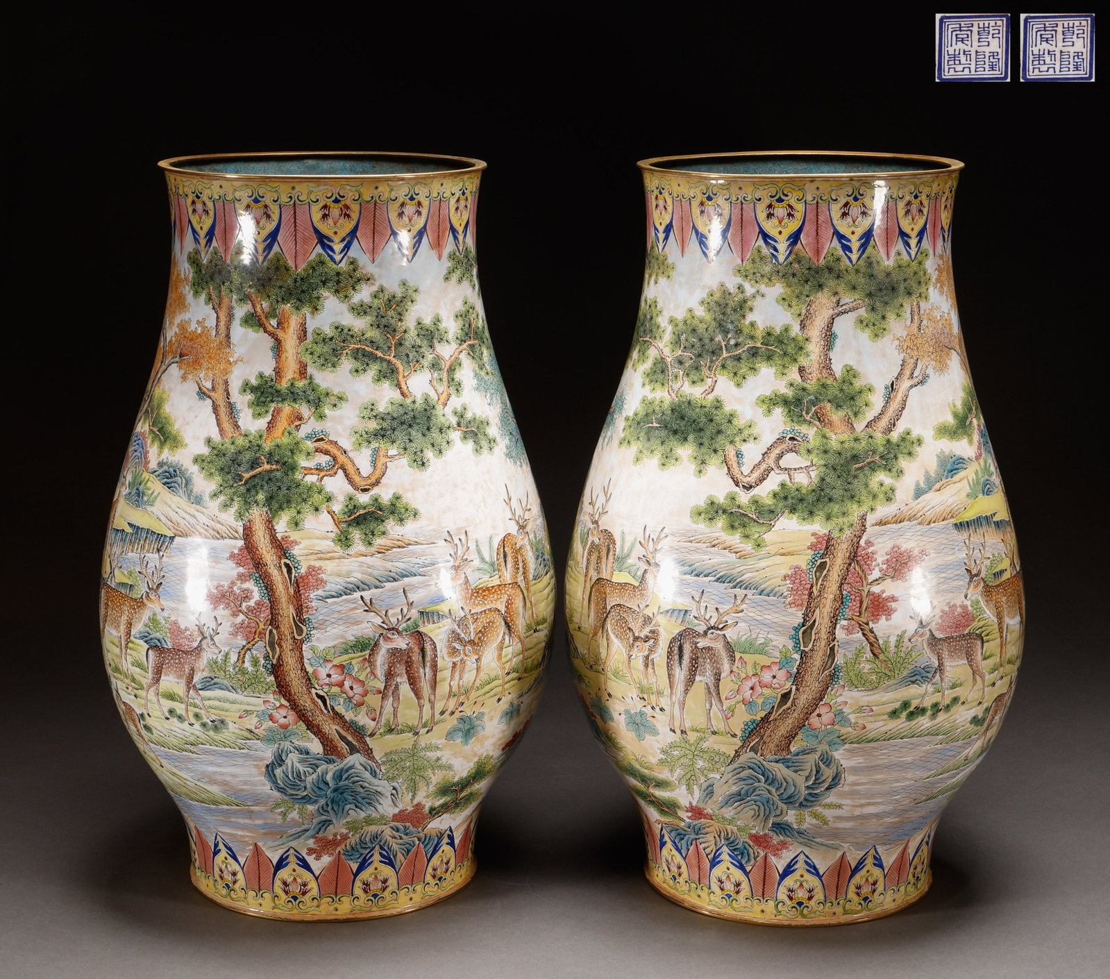 A pair of enamel colored animal and plant patterned bottles with copper body in the Qing Dynasty: A pair of large statues with deer patterns in the Songxi group painted with enamel on a copper body in the Qianlong yearSpecification: 52 cm in height and 32cm in width, with a total weight of 8800g. 