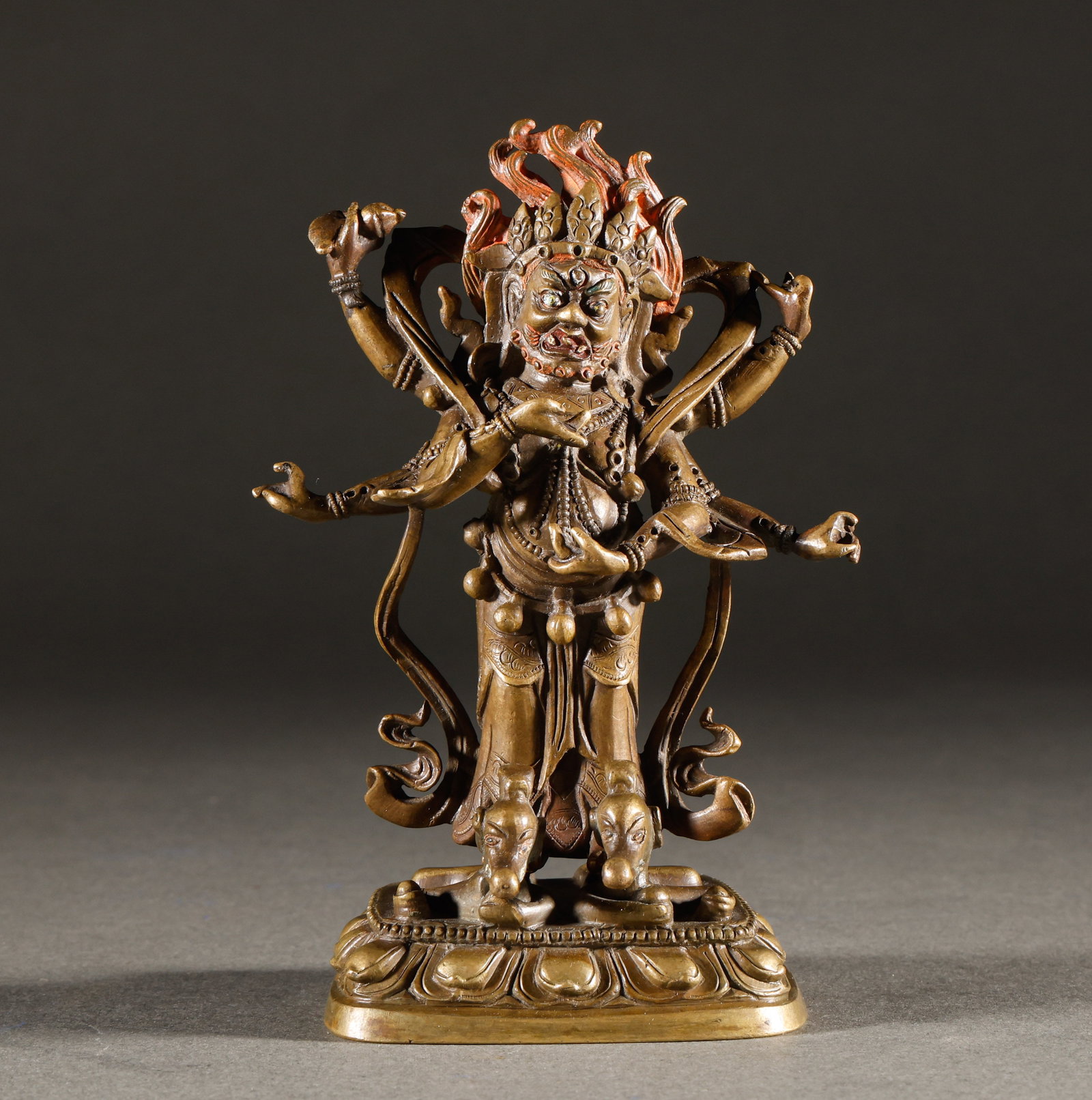 Ming Dynasty copper, bronze, gold, six armed Mahagala: Brass painted six arm protective bronze statueSpecification: Height 12-8cm, weight 396g, six arm holder, facial decoration, intricate details of tassels and ribbons, orderly stepping on beasts and lot