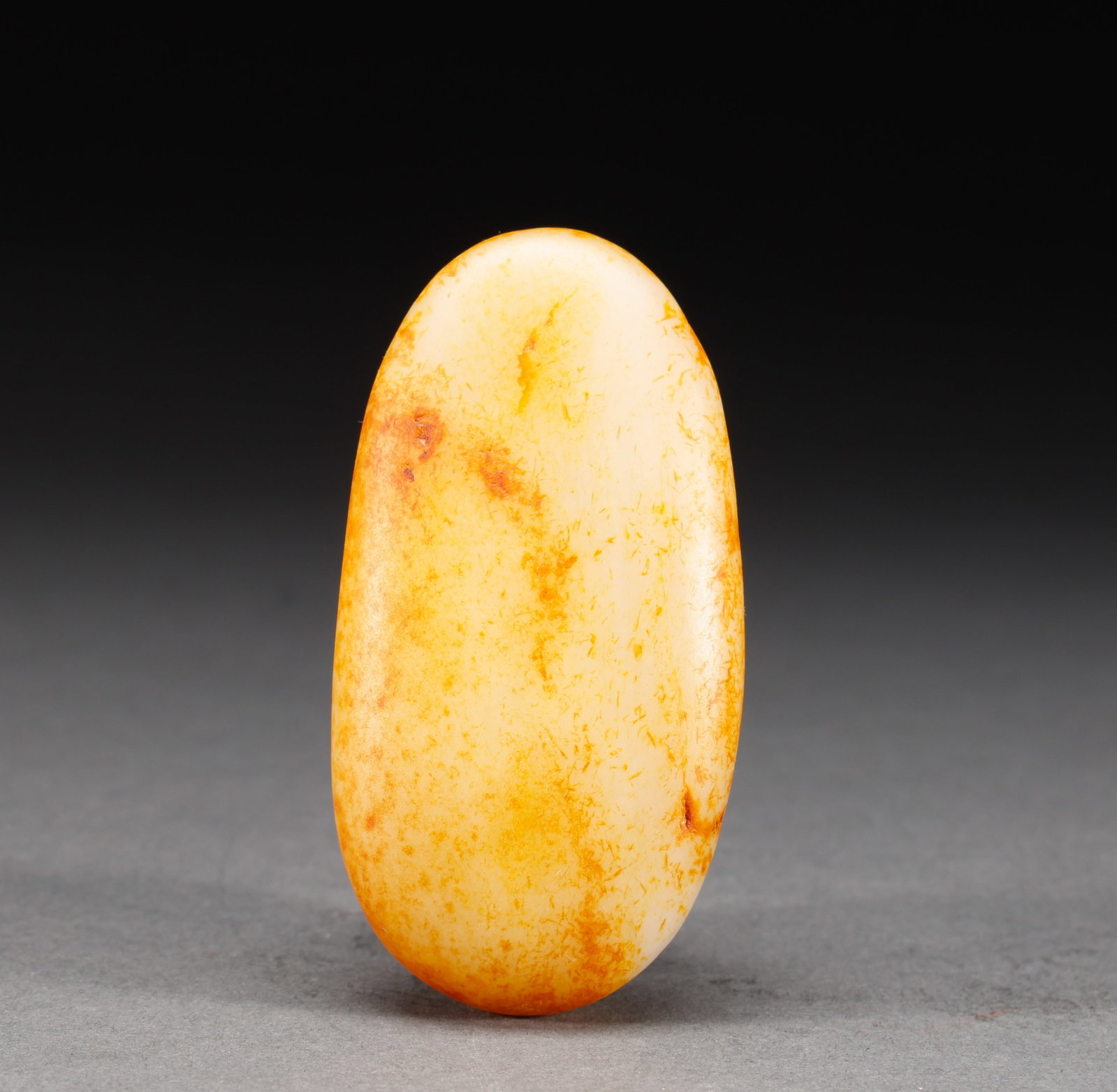 Hotan Jade Original Stone of Qing Dynasty: Hotan Jade is a natural red skin stone seed, with a specification of 8cm high, 4.5cm wide and 112g weight. The pebble is round in shape, fine and greasy in jade quality, natural skin color is loose