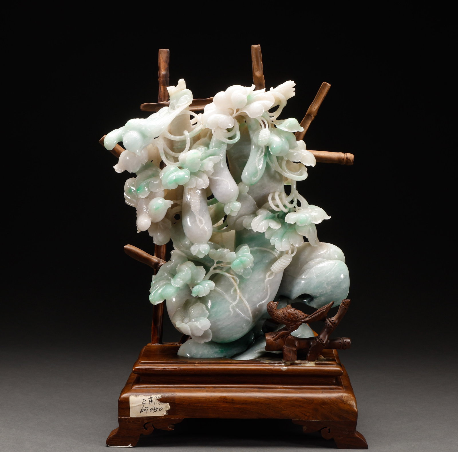 Jade Melon and Fruit Ornaments from the Qing Dynasty: Floating green jade hollow out lucky melon flower and bird ornament, size 27 ?? 23cm, weight 3709g. The whole material is multi-layered translucent carved melon fruit flower and bird, with a lively gr
