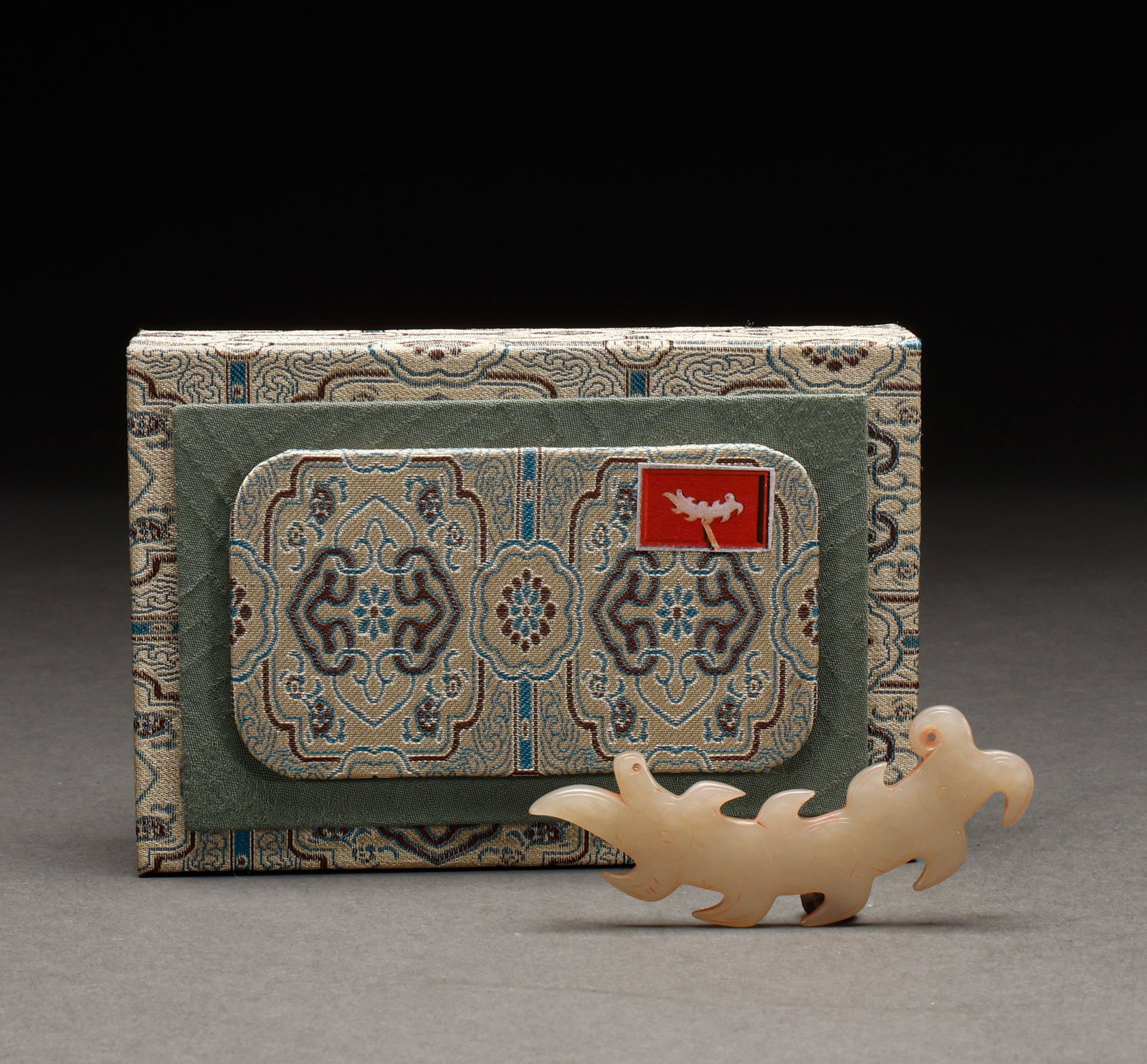 Hotan Jade accessories before the Ming Dynasty: Pre-Ming Hetian Jade Ornament. Crafted with the consummate skill of a golden age, the piece measures 9 cm in length, is 3.5 cm wide, and weighs 20 g. The jade is warm and translucent with naturally me