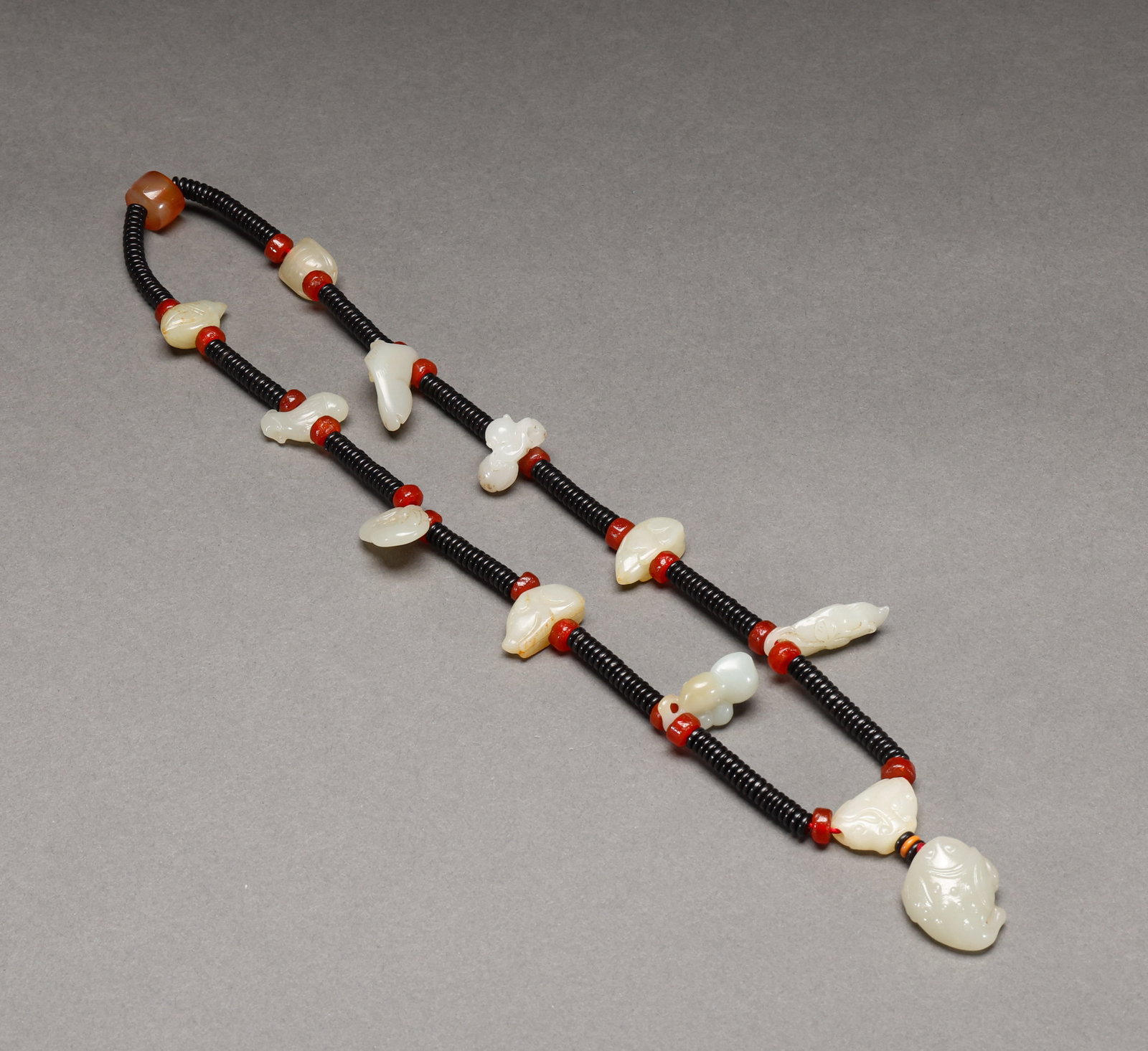 Hotan Jade accessories before the Ming Dynasty: Pre-Ming Hetian Jade Ornament. Crafted with the consummate skill of a golden age, the piece measures 34 cm in length, stands 1.2 cm tall, is 2.5 cm wide, and weighs 95 g. The jade is warm and transluc