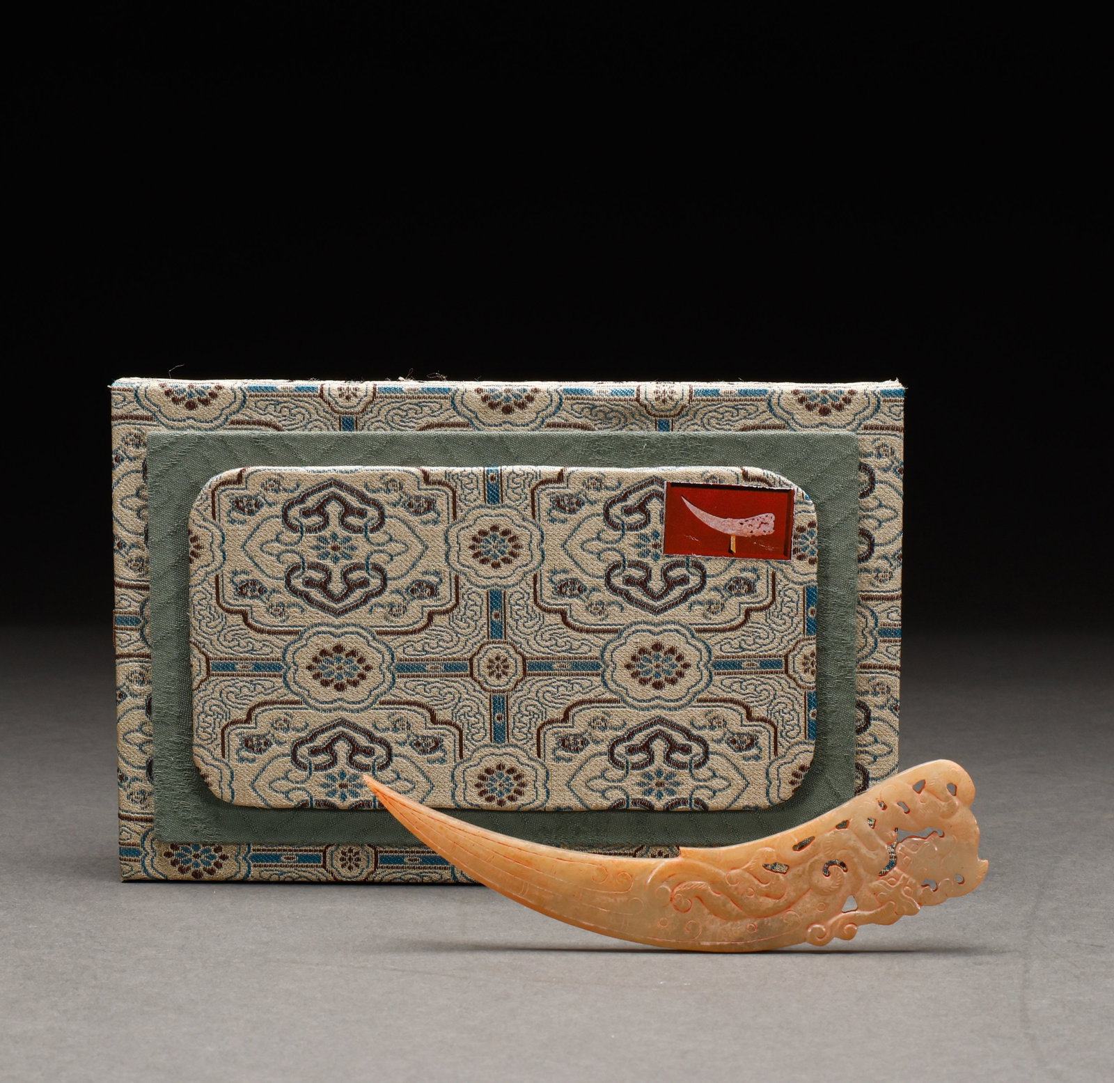 Hotan Jade accessories before the Ming Dynasty: Pre-Ming Hetian Jade Ornament. With a quiet, dignified air of refined elegance, the piece measures 14 cm in length, is 3 cm wide, and weighs 34 g. The tone is rich and the lapidary work superb, the mo