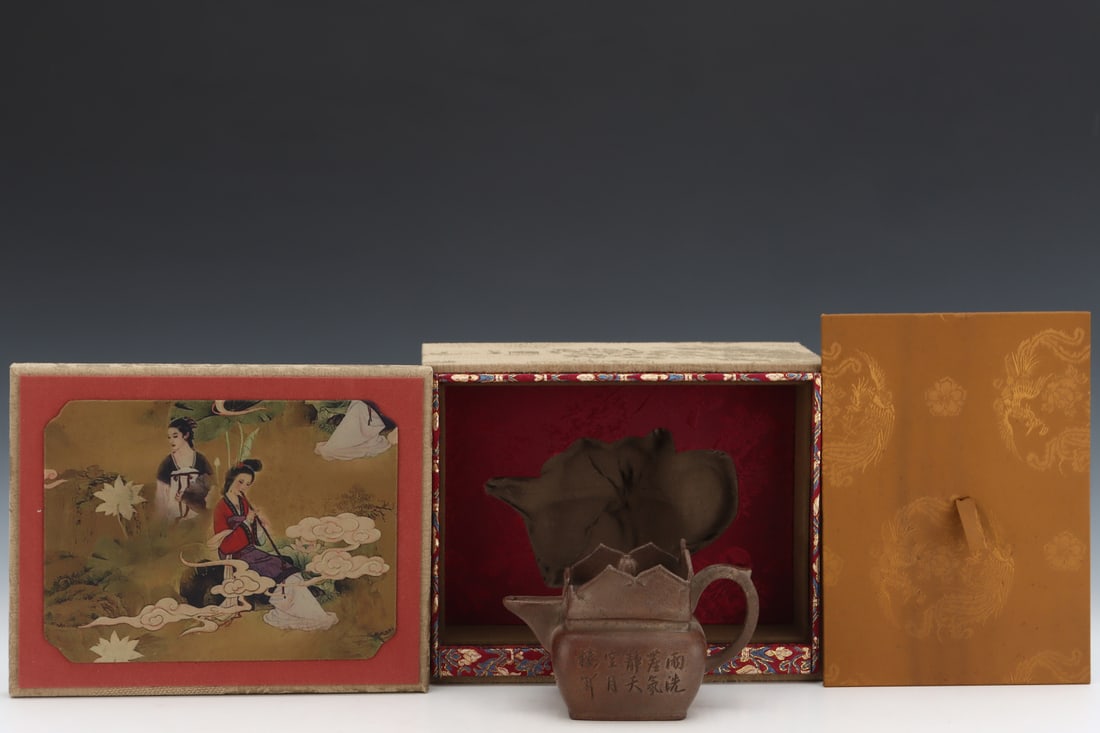 Qing Dynasty Purple Clay Monk's Hat Pot and Tea Set: Qing-Dynasty Yixing Monk's Cap Teapot with Tea Set. Lofty in style and timeless in appeal, the piece stands 10 cm tall, and is 14 cm wide. The modeling is refined and the ornamentation rich, marking i
