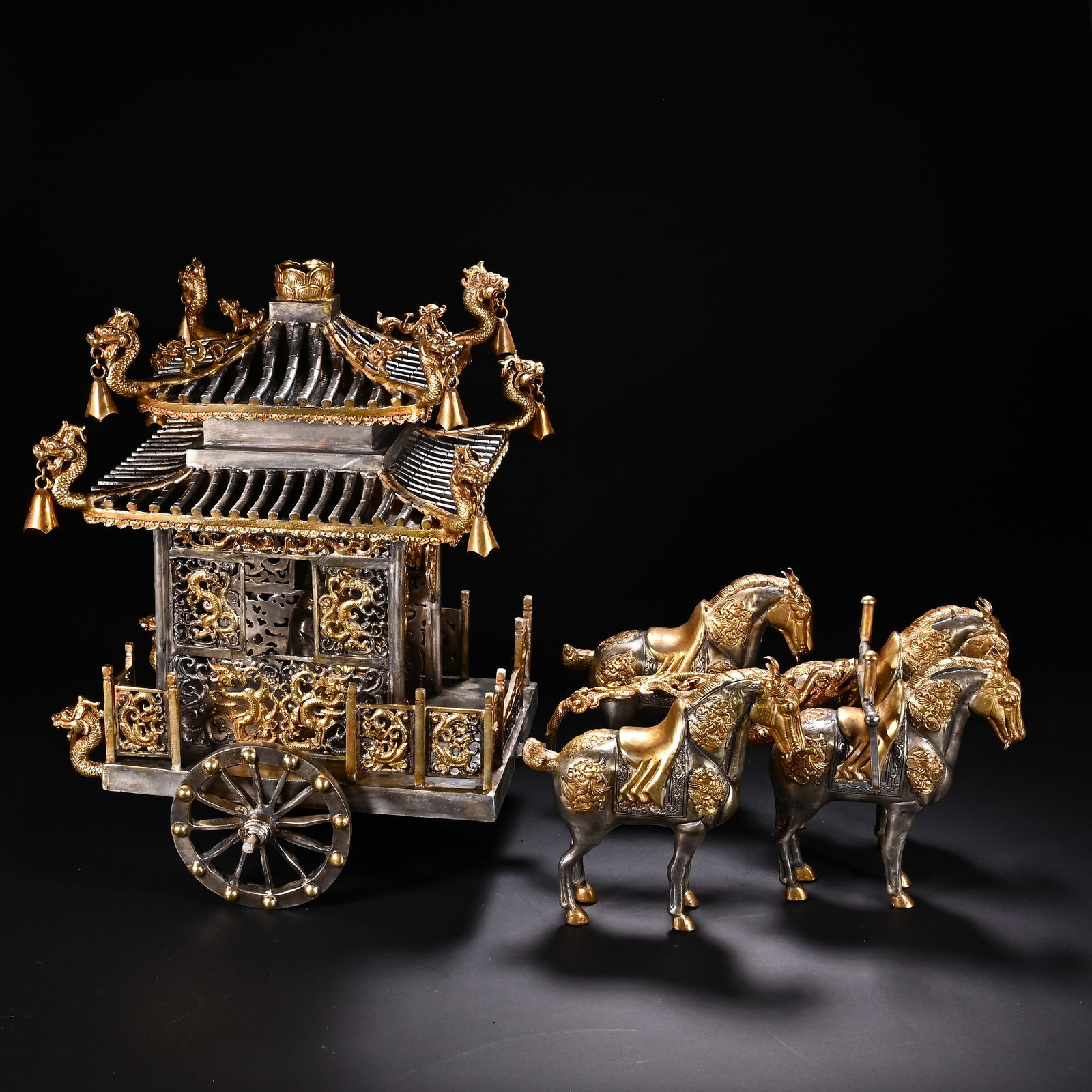 Qing Dynasty bronze gilded golden horse cart: Qing-Dynasty Gilt-Bronze Horse-Drawn Carriage. Imposing in presence and radiant with vitality, the piece stands 32 cm tall, and is 46 cm wide. The bronze is of pure quality with a settled patina, fine