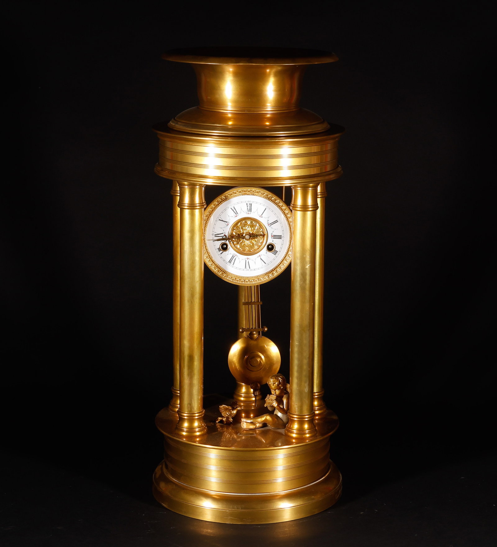 Old Tibetan European style copper gilded iron: Old Collection European Gilt-Bronze Clock. Crafted with the consummate skill of a golden age, the piece stands 67 cm tall, is 28.5 cm wide, and weighs 14,597 g. The bronze is of pure quality with a se