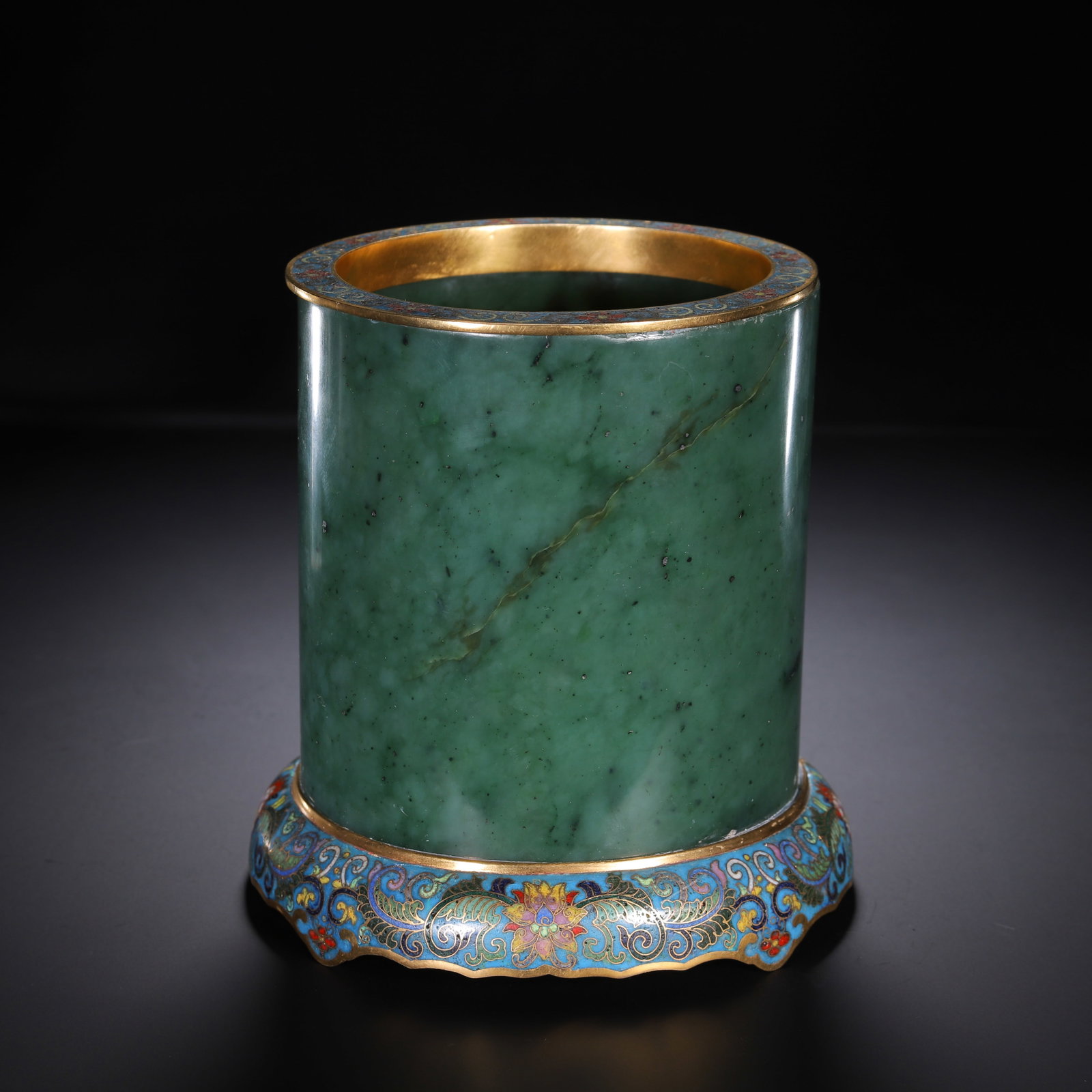 Qing Dynasty Hetian Biyu inlaid cloisonn ?? pen holder: Qing-Dynasty Hetian Jasper Brush Pot Inlaid with Cloisonn??. Of superb material and workmanship alike, the piece stands 15.5 cm tall, and is 15 cm wide. Fine-grained and thickly patinated, complete in