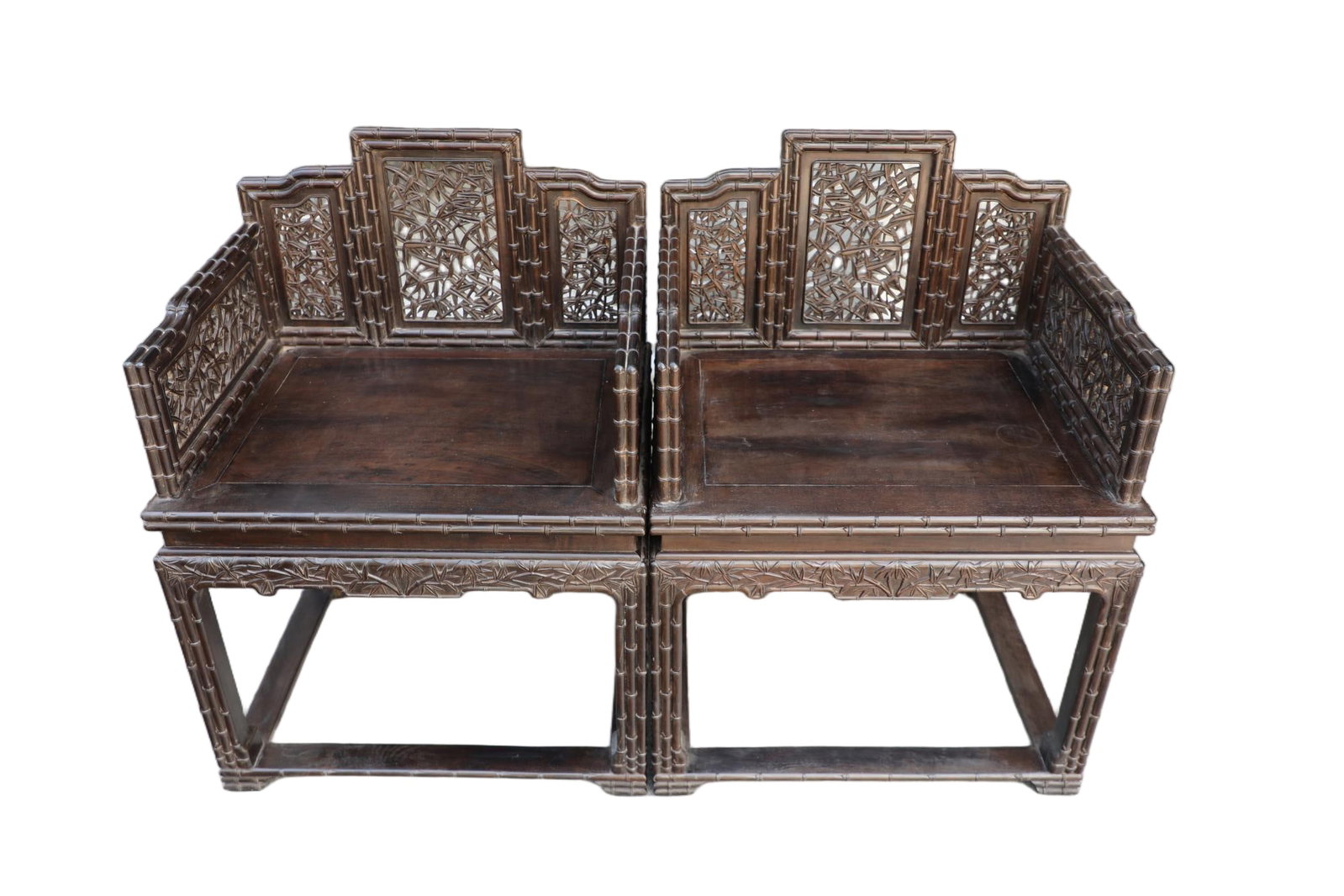 A pair of Qing Dynasty purple sandalwood carved bamboo knot patterned Grand Preceptor chairs: Qing-Dynasty Pair of Zitan Openwork Bamboo-Joint Grand Chairs. Elegant and serene, with a naturally refined bearing, the piece measures 60 cm in length, is 48 cm wide, and stands 81 cm tall. The grain