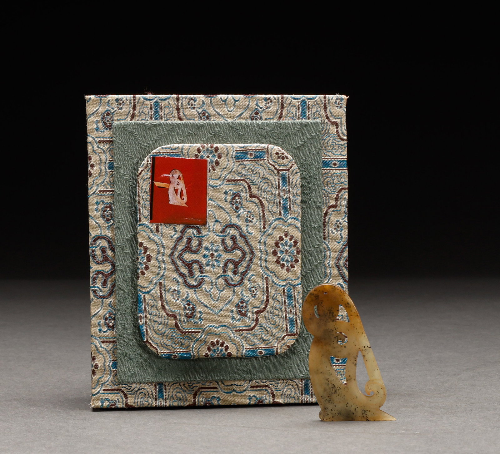 Hotan jade figurines before the Ming Dynasty: Pre-Ming Hetian Jade Figurine. Perfectly formed and full of distinctive charm, the piece stands 5 cm tall, is 2.8 cm wide, and weighs 8 g. Fine-grained and thickly patinated, complete in form and spir