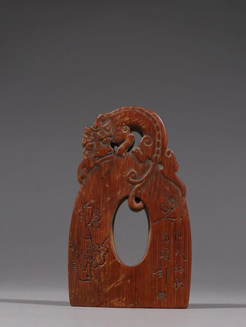 Qing Dynasty bamboo carved auspicious beast plum blossom pattern seal: Qing-Dynasty Bamboo Carved Seal with Auspicious Beast and Plum Motifs. Meticulously worked with singular artistry, the piece stands 10 cm tall, and is 5.8 cm wide. The material is glossy, the carving 