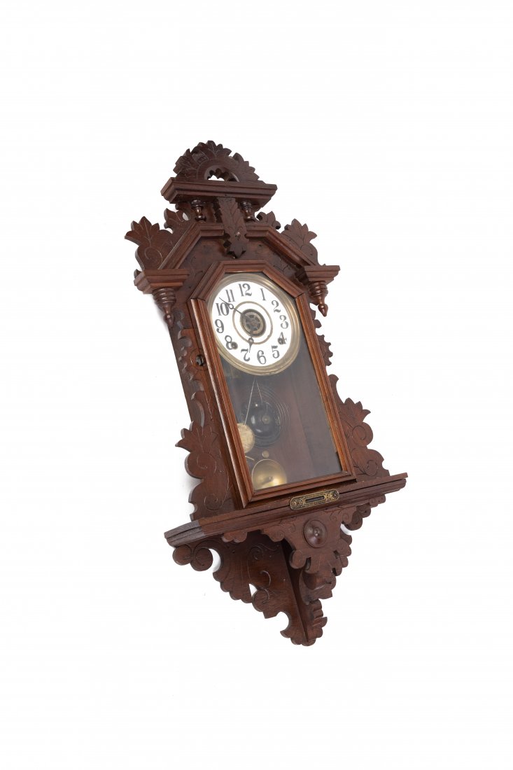 An ornate walnut antique wall mount pendulum clock (0115) on Jan 17