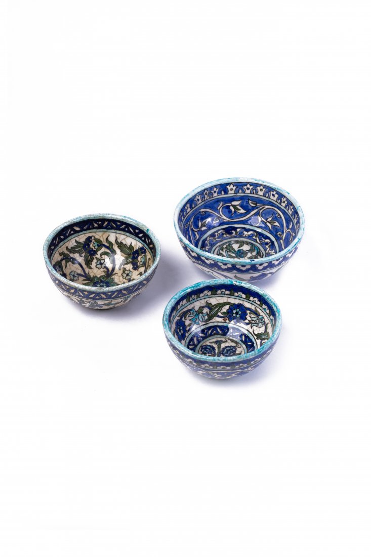 A vintage set of tiny and medium sized cups made of a: A vintage setof tiny and medium sized cups made of a porcelain