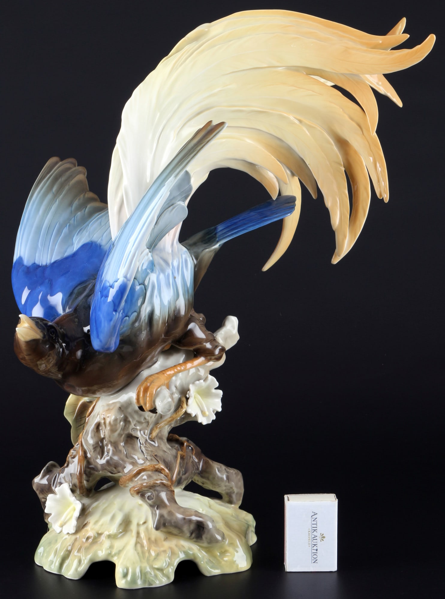 Hutschenreuther large bird of paradise, Hans Achtziger, groÃŸer Paradiesvogel,: porcelain, green company mark, design by Hans Achtziger (1918-2003), large bird of paradise on branch base, H 40 cm x W 29 cm x D 33 cm