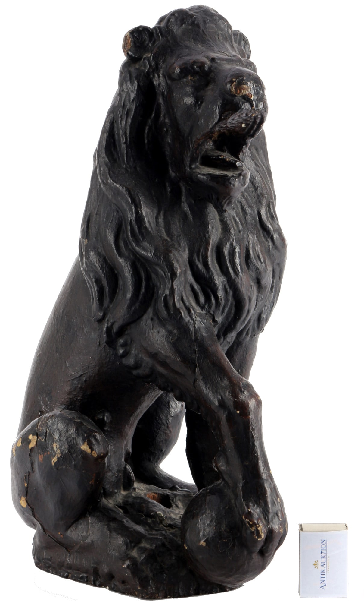 17th/18th Century Baroque lion wooden figure, 17./18. Jahrhundert Barock LÃ¶we Holzfigur,: wood, painted several times in black, Baroque wood carving, a seated lion with a paw on a ball, an attachment hole in the base, H 44 cm x W 18 cm x D 26 cm, flaws in the socket, small flaws in the woo