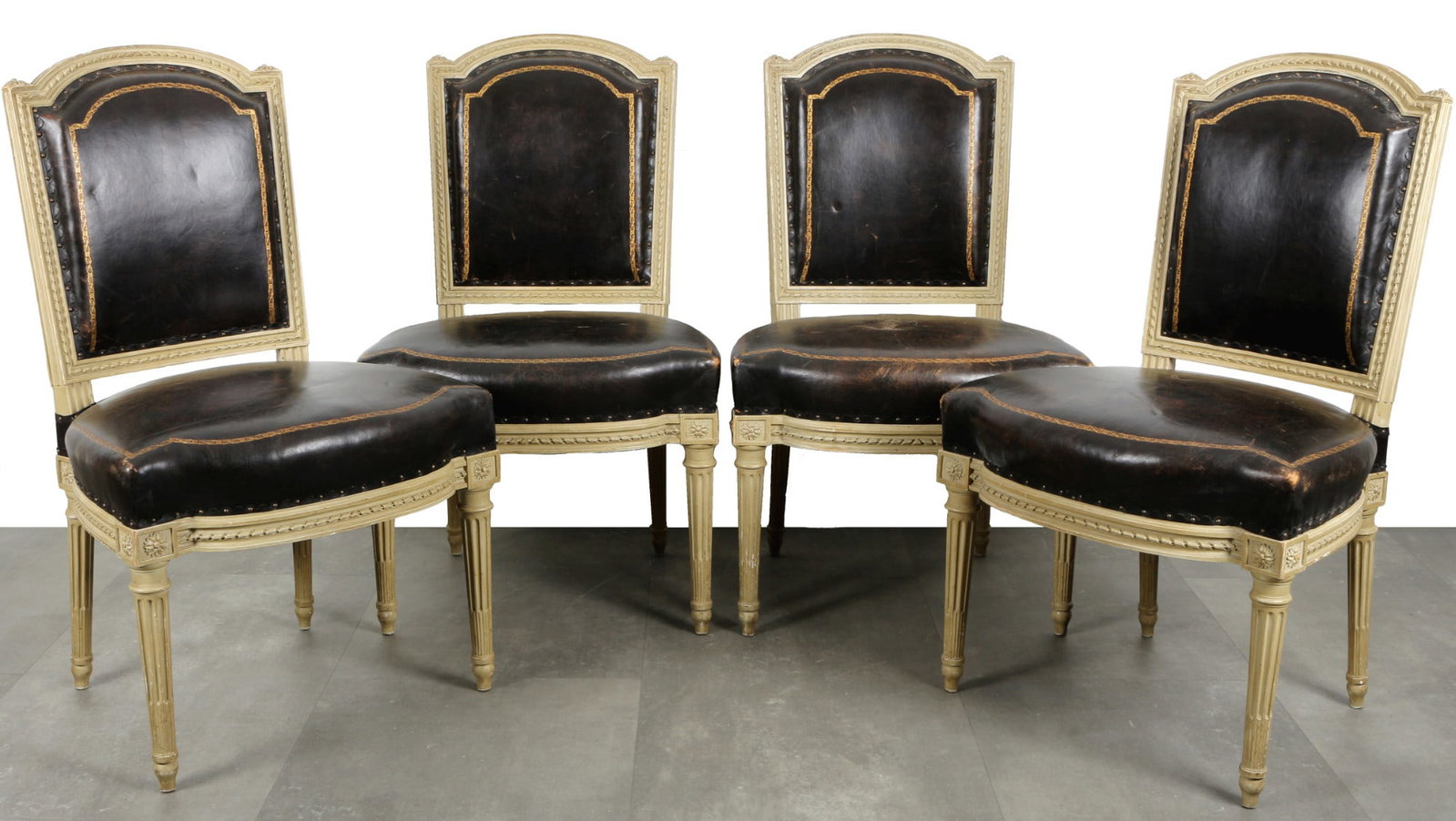 4 chairs in Louis XVI style, France 19th century,: Carved and painted wood, set of 4 chairs in the Louis XVI style, France 19th century, body and backrest decorated with classicist band decorations and rosettes, seat and backrest covered with leather,