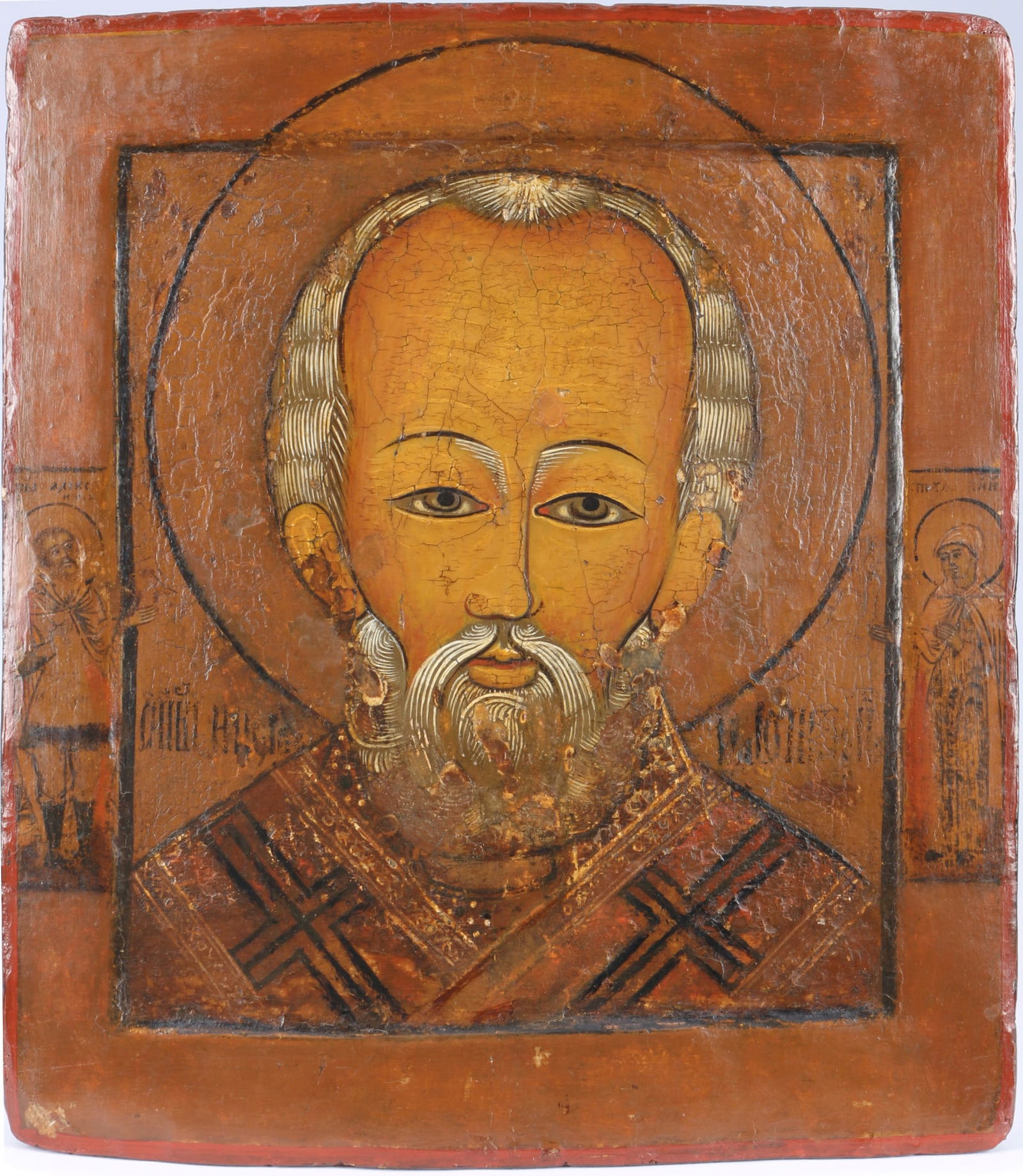 Russia icon 17th Century - Saint Nicholas of Myra,: Russia, Kiev School, 17th century, egg tempera on chalk ground, painted on wooden panel, depiction of Saint Nicholas of Myra, flanked by Jesus Christ and the Mother of God, Cyrillic writing engraved o
