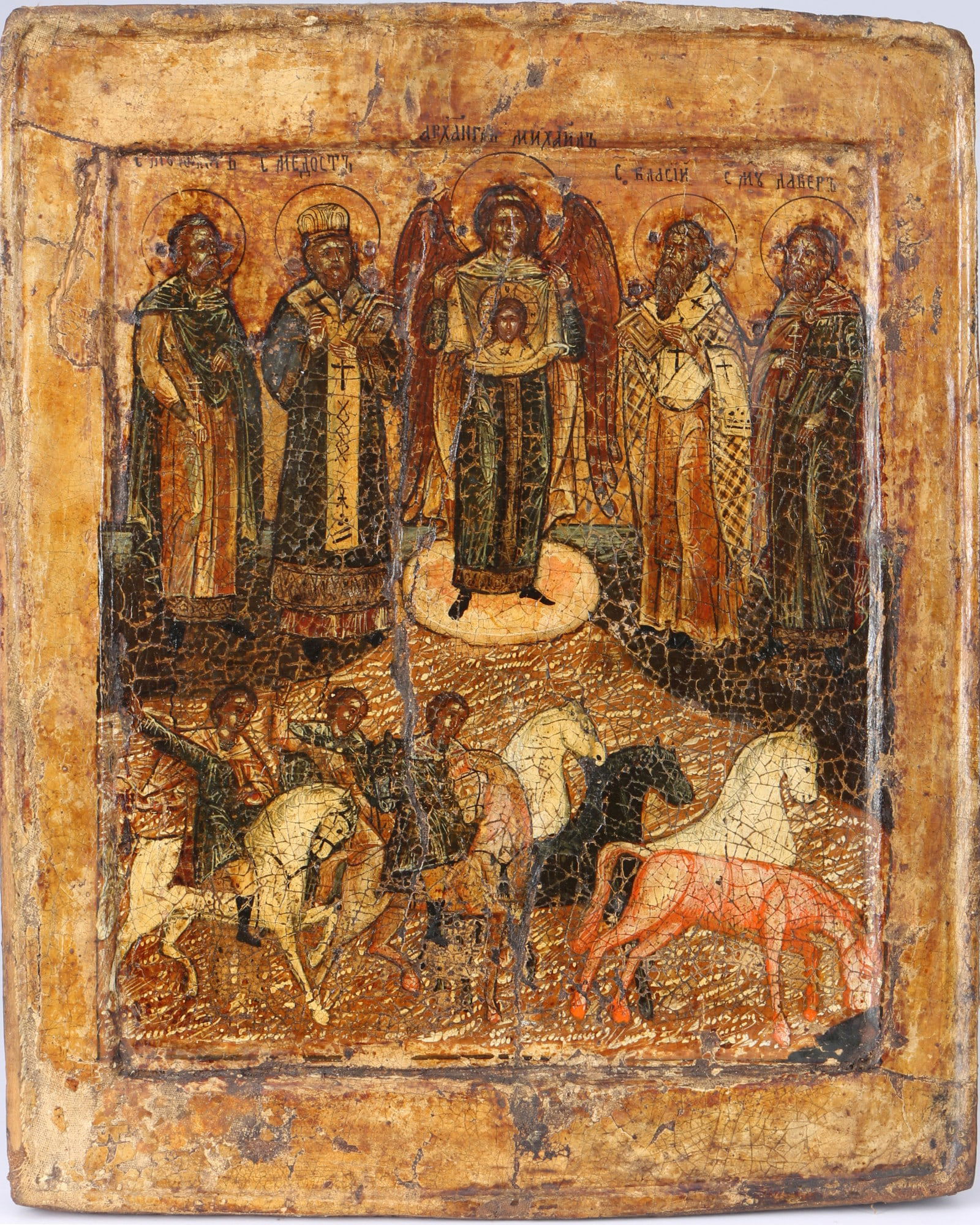 Russia icon 17th century - Archangel Michael with Saints Florus and Laurus,: Russia, egg tempera on chalk ground, painted on wooden panel, depiction of the Archangel Michael with Saints Florus and Laurus - as well as other saints such as Saint Blaise, one reverse sponki presen