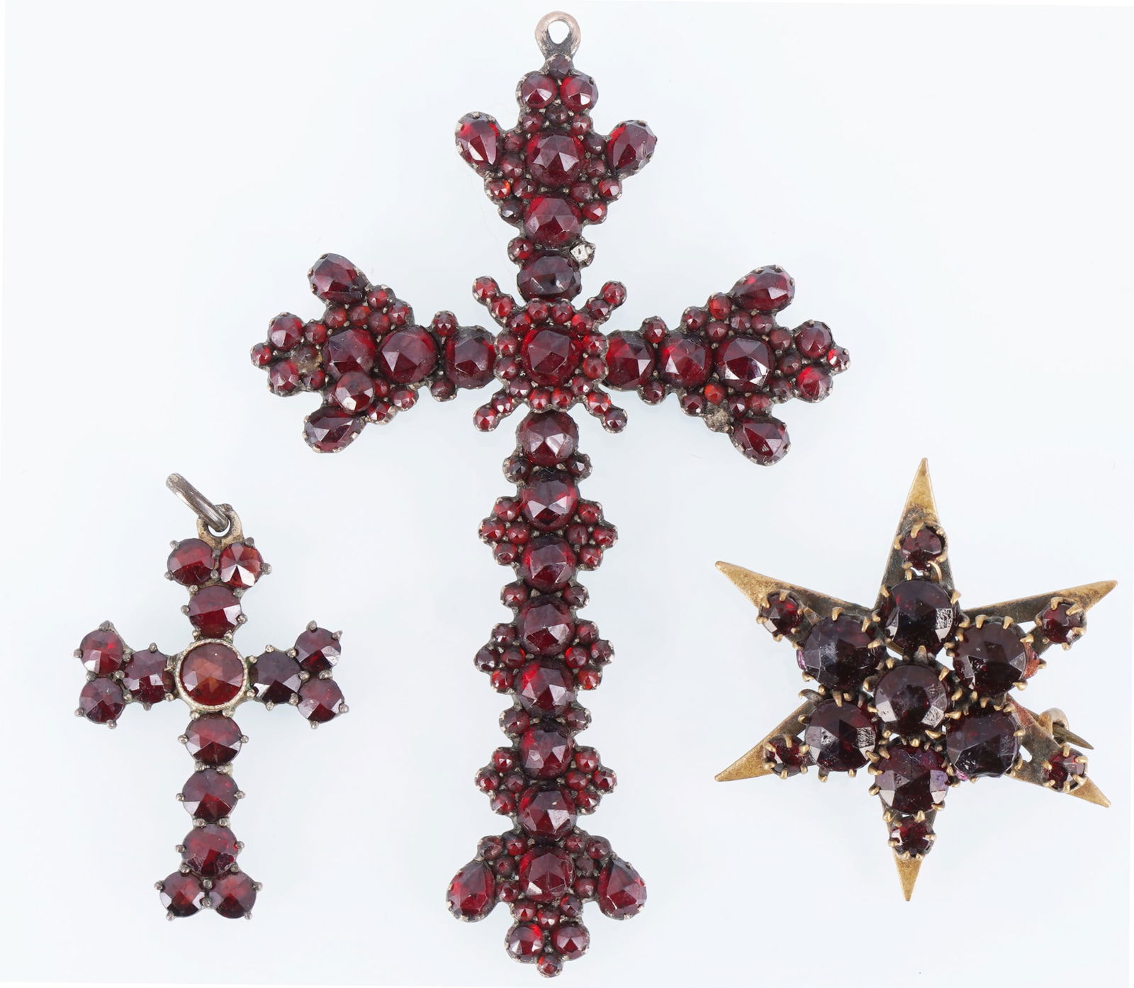 Garnet jewelry Bohemian garnet 2 cross pendant and brooch,: Two antique cross pendants and a brooch with Bohemian garnets, including rose-cut and tombac-set stones; pendant dimensions (H with bail): 68 mm x 40 mm and 29 mm x 16 mm; brooch dimensions (D): 33 mm