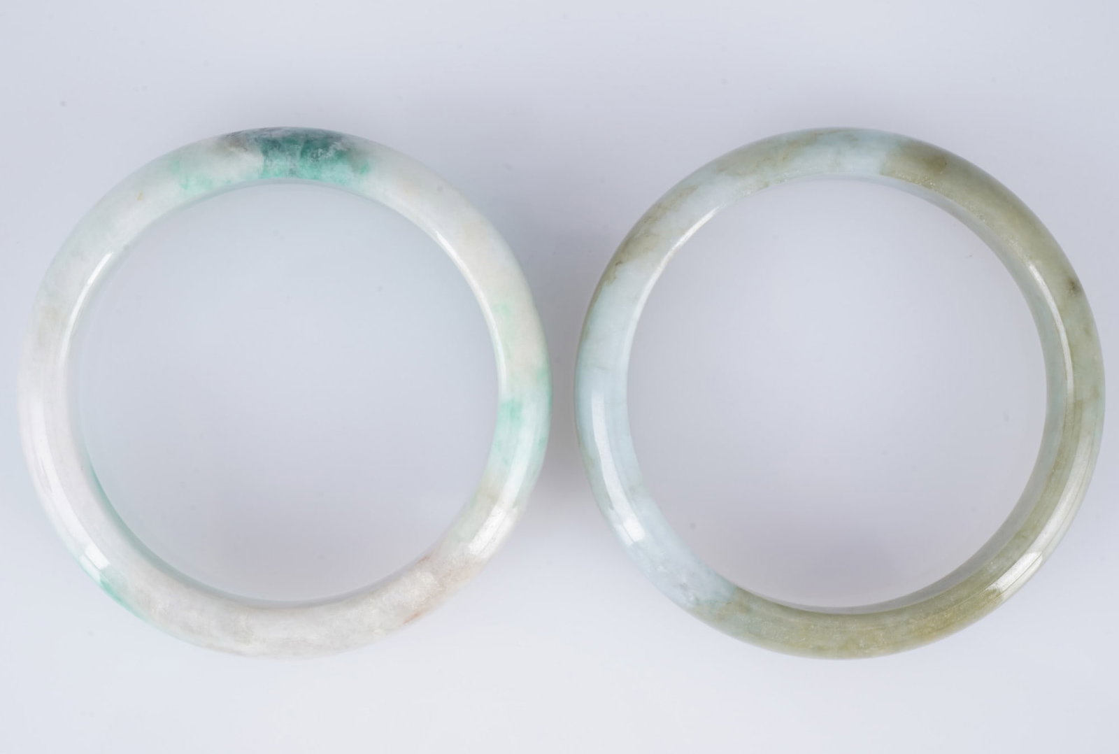 Two jadeite bangles, China, - 2