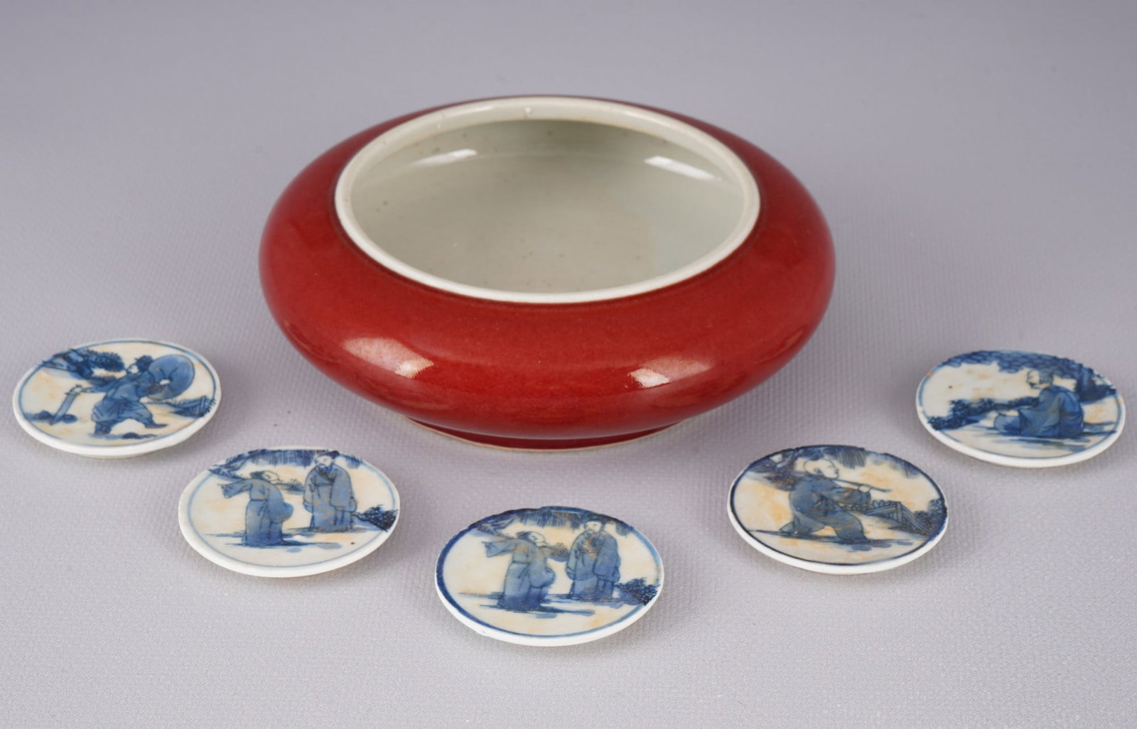 Bowl with red glaze and five shard-cut plates, China, (1 of 5)