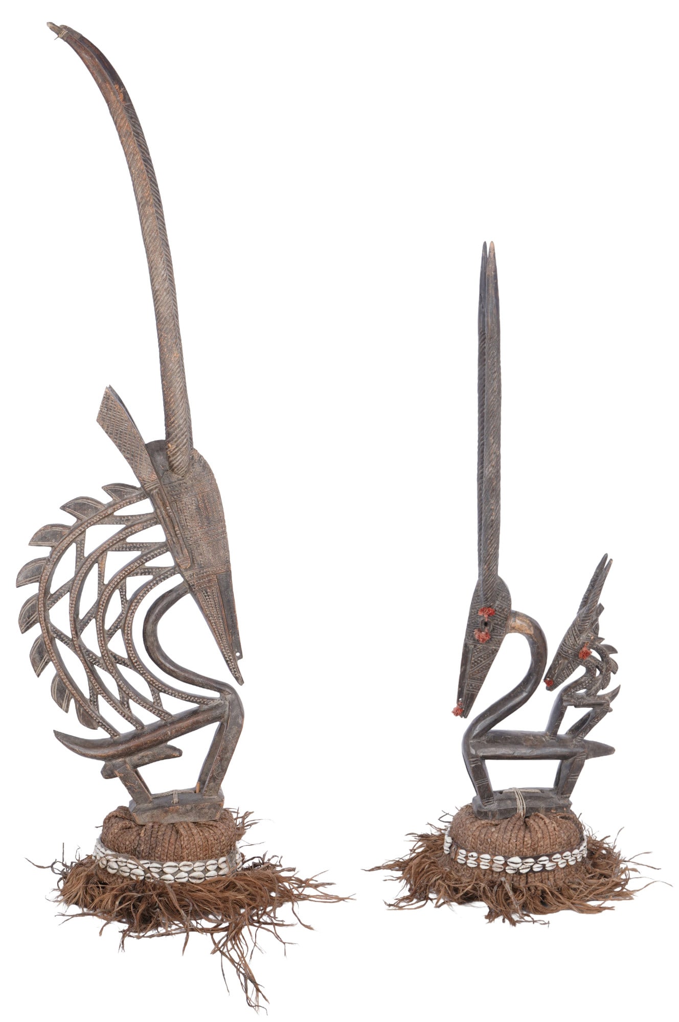 Pair of Chiwara headdresses: Carved wood, Bambara Mali, two ritual headdresses as a pair, one with curved horns and one with straight horns, H 118 cm x W 30 cm and H 92 cm x W 25 cm, one horn glued, signs of age, provenance: priv