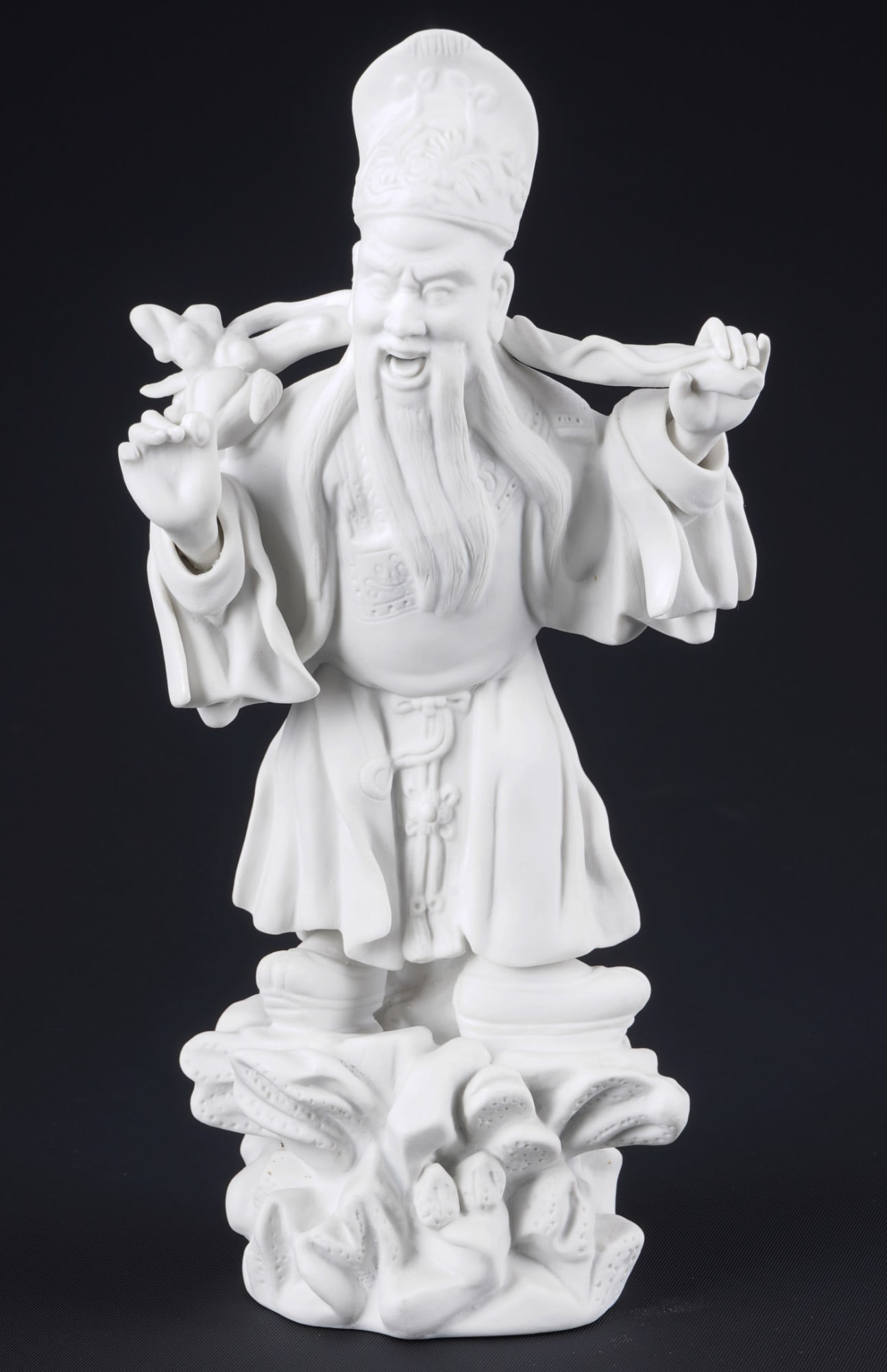 Herend Tung Fung-Shu character figure,: bisque porcelain, Hungary 20th century, press mark, Tung Fung-Shu - scholar, official and magician at the court of Emperor Wu (Han dynasty), model no. 5677 005, signature underneath, H 21 cm x W 10 cm