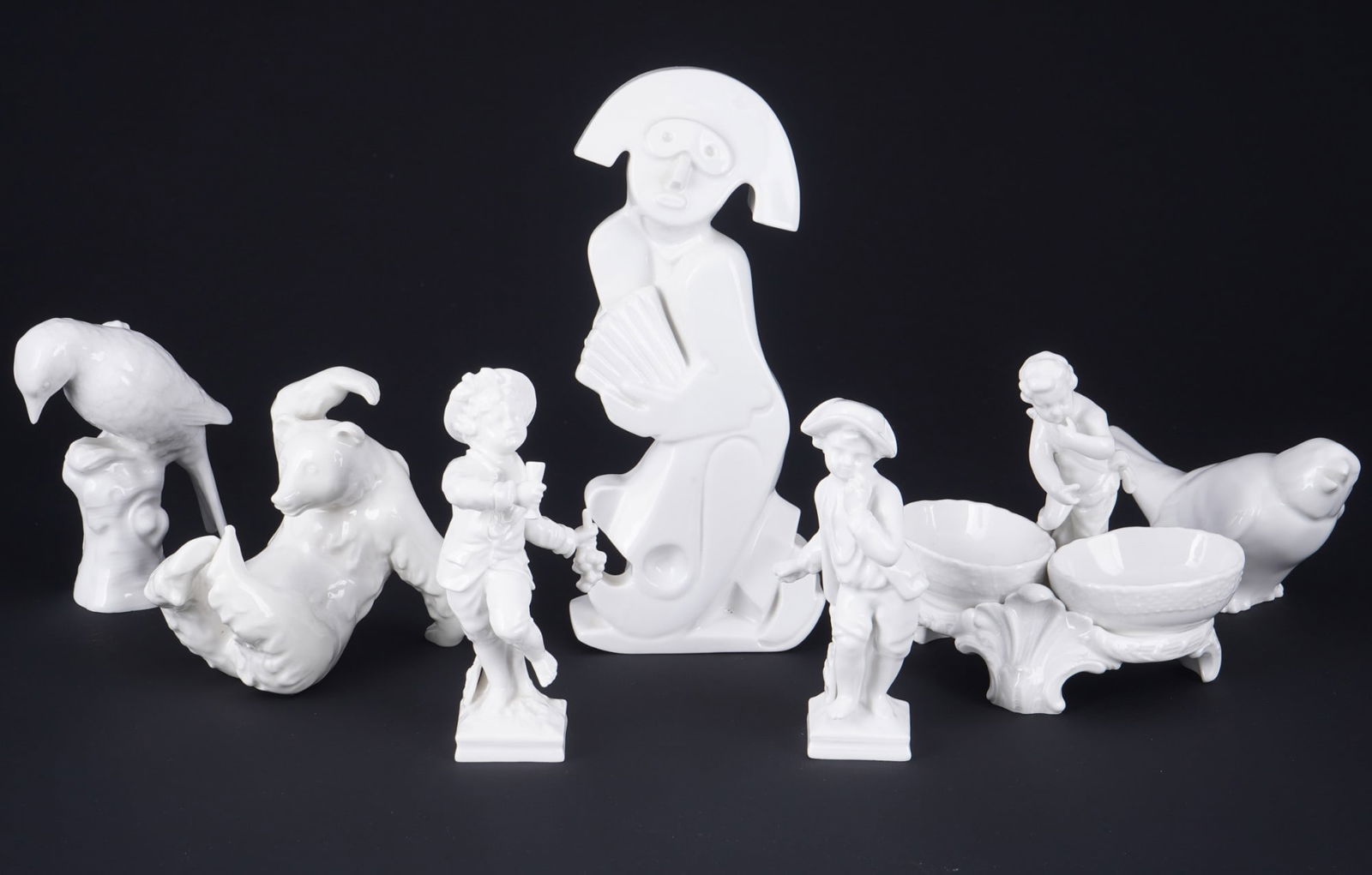 KPM Berlin White 7-piece figurine collection,: porcelain, Royal Porcelain Manufactory Berlin, blue sceptre mark, 7 various figures, 1x Pierrot H 18.5 cm, 2x monthly figures lion / crab H 11 - 12 cm, 1x cherub salt cellar H 10.5 cm x W 11.5 cm, 2x
