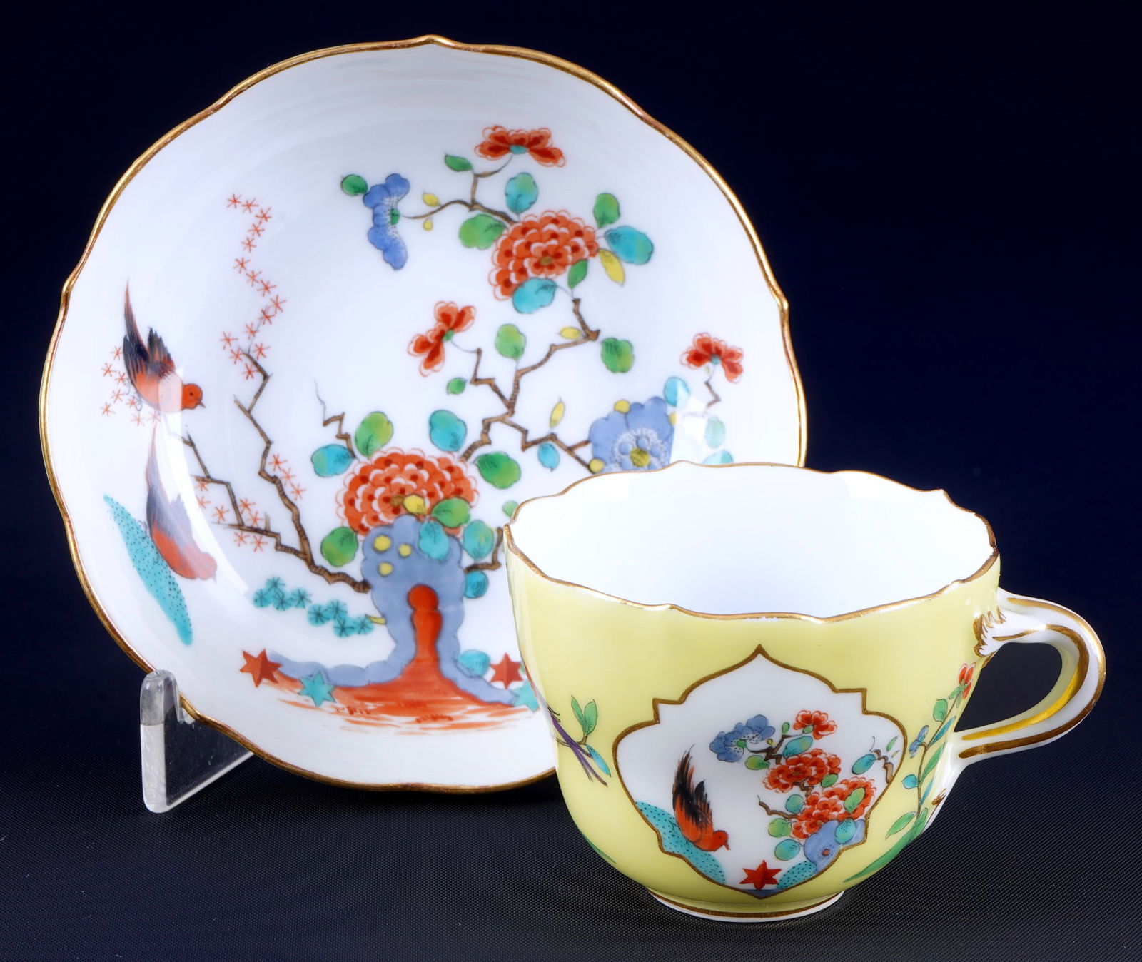 Meissen Indian Rock, Flowers and Bird Painting mocha cup with yellow ground 1st choice,: porcelain, blue sword mark 1st choice, Pfeiffer period 1924-1934, decor Indian Rock, Flowers and Bird, on yellow ground, saucer also painted underneath, mocha cup H 5.5 cm x D 6.5 cm, saucer D 10.5 cm