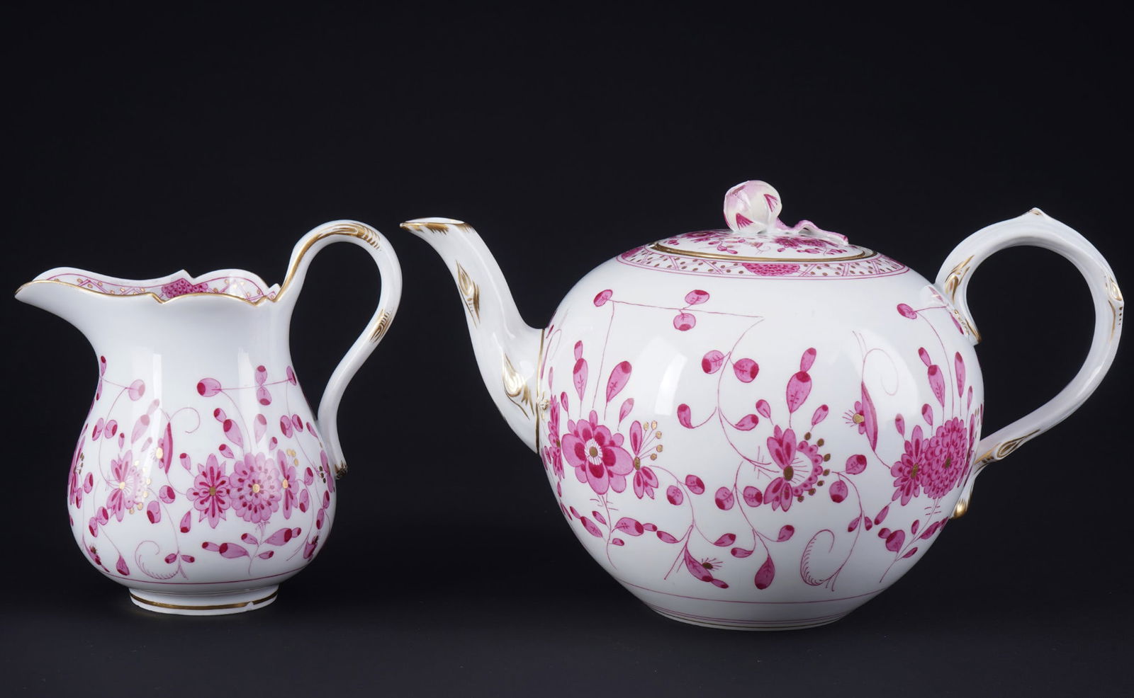 Meissen Indian Purple Rich tea pot with milk jug 1st choice,: porcelain, blue sword mark 1st choice, Pfeiffer period 1924-1934, decor Indian Purple Rich, 1x tea pot H 13.5 cm x L 24 cm x D 15 cm, 1x milk jug H 13 cm x D 8.5 cm, chip on the rose knob and 2 chips