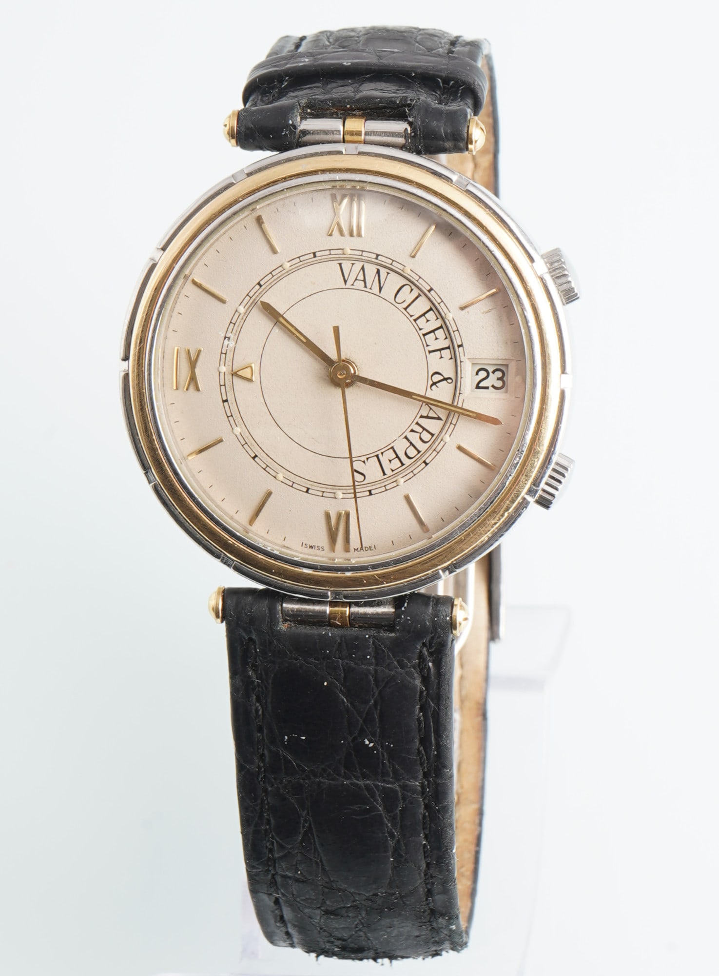 Van Cleef & Arpels Memento Men's Wristwatch: Steel and 18k gold case, mechanical hand-wound movement with alarm, model Memento, Ref. No. 43989 423 003, No. 17, beige dial with company logo, Roman numerals and gold baton indices, alarm function