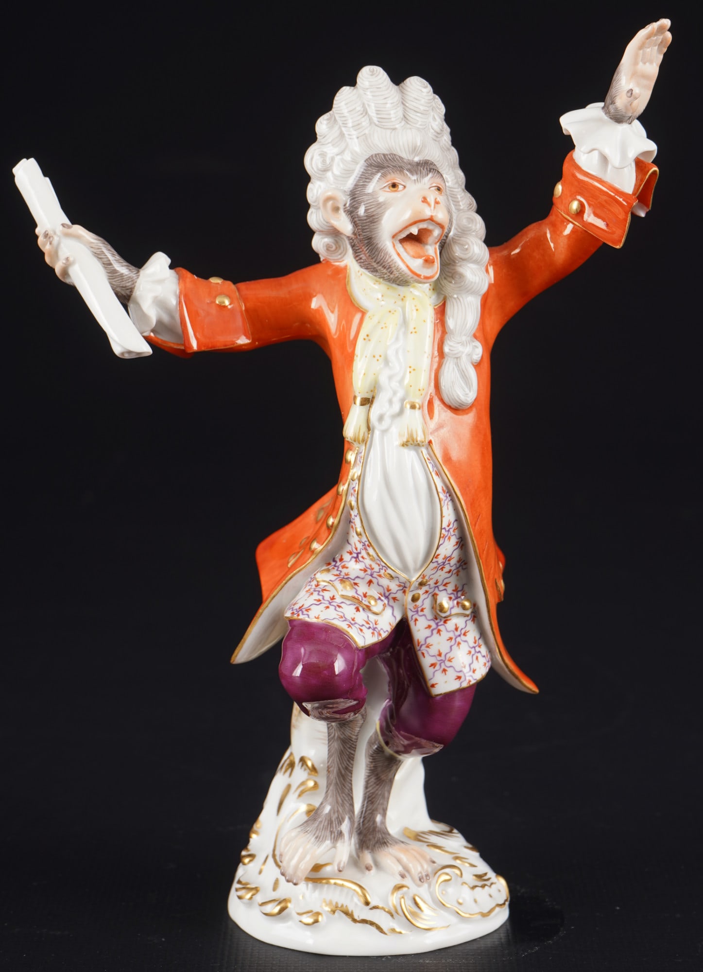 Meissen Monkey Chapel conductor 1st choice - J.J. KAENDLER,: porcelain, blue sword mark 1st choice, design by Johann Joachim KAENDLER (1706-1775) around 1753, model no. 60001, conductor / conductor in orange frock coat from the Monkey Chapel, height 17.5 cm,