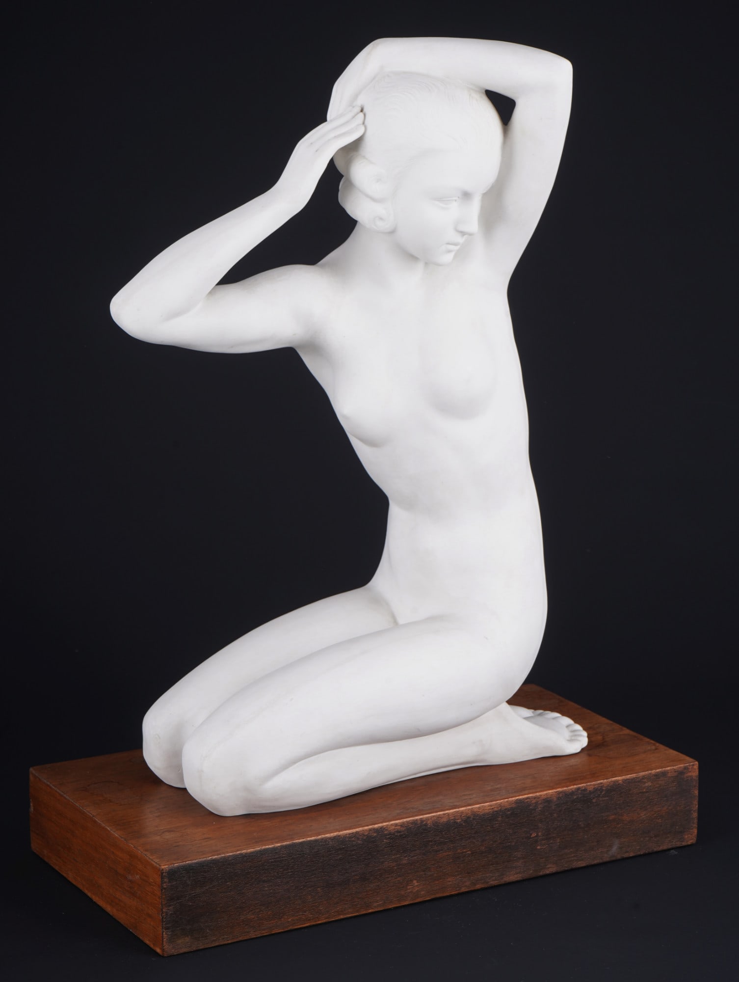 Zoltan KOVASZ (1883-1952) Art Deco female nude styling her hair,: bisque porcelain, Parisian press mark between the feet, signed Z. Kovatz on the right lower leg, female nude - styling her hair, without wooden base H 41 cm x W 28.5 cm x D 13 cm, fine production