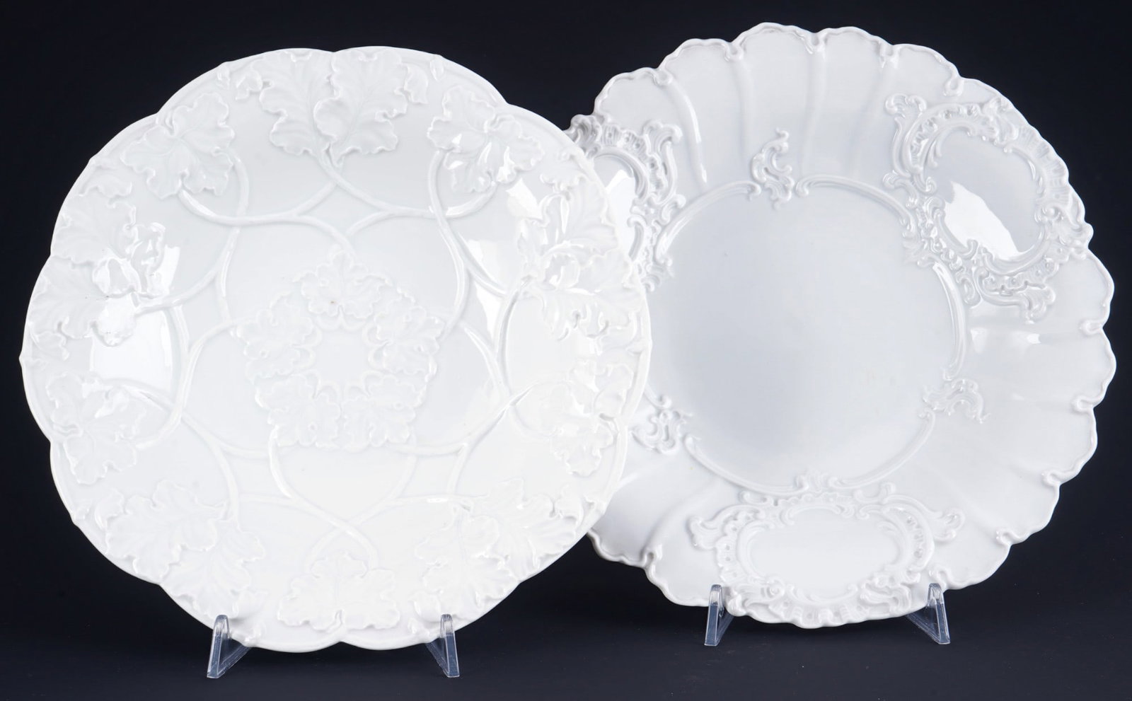 Meissen decorative bowls B-Form and with vine leaf relief,: porcelain, blue sword mark with four grinding strokes 4th choice, B-Form/Vine leeaves, 1x splendid bowl H 4.5 cm x D 29.5 cm, 1x splendid bowl H 5 cm x D 28 cm, abrasion, firings flaws