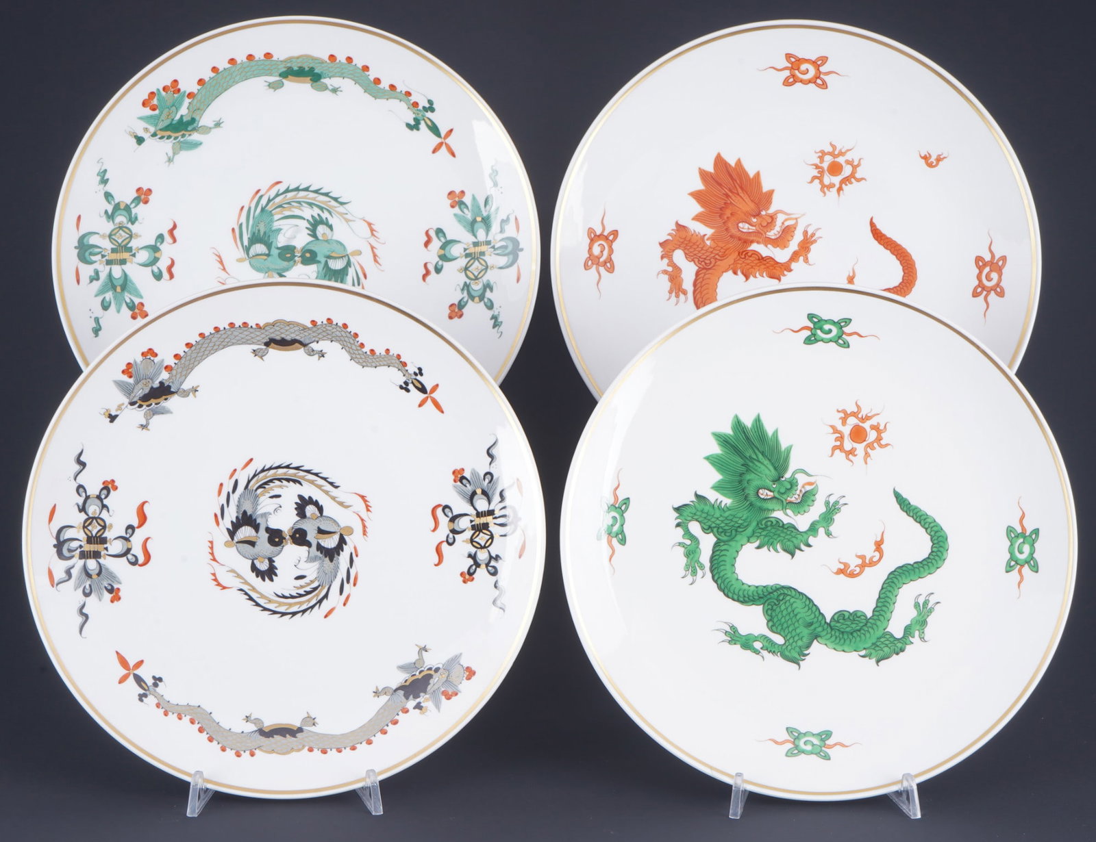 Meissen Court Dragon Rich / Ming Dragon 4 wall plates 1st choice,: porcelain, blue sword mark 1st choice, decor Court Dragon Rich Black/Green and Ming Dragon Red/Green (green Ming Dragon house painting), 4x D 25.5 cm, with wall brackets