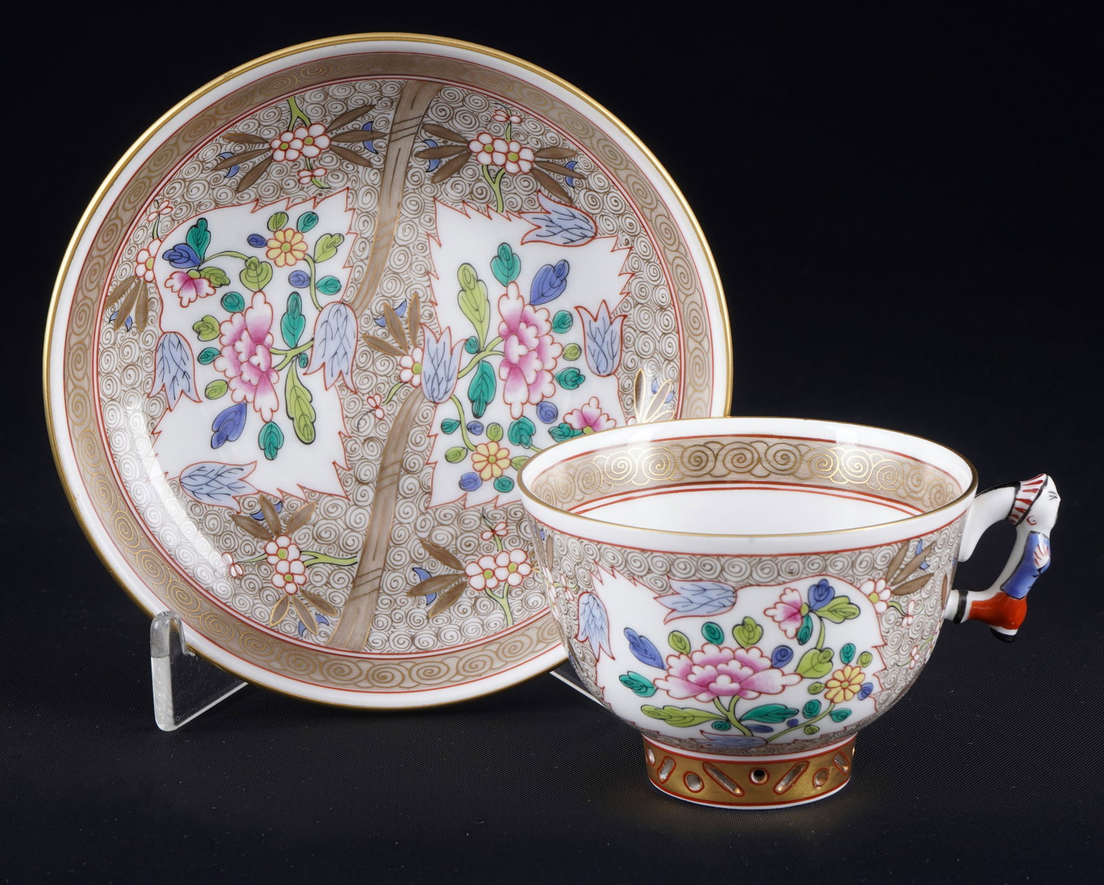 Herend Cubash Chinoiserie splendid - mocha cup with figurative handle 3371,: porcelain, Hungary 20th century, blue company mark, decor CU Cubash Chinoiserie - delicate floral painting, figurative handle, cup and saucer base with cutwork, model no. 3371, 1x mocha cup H 5 cm x