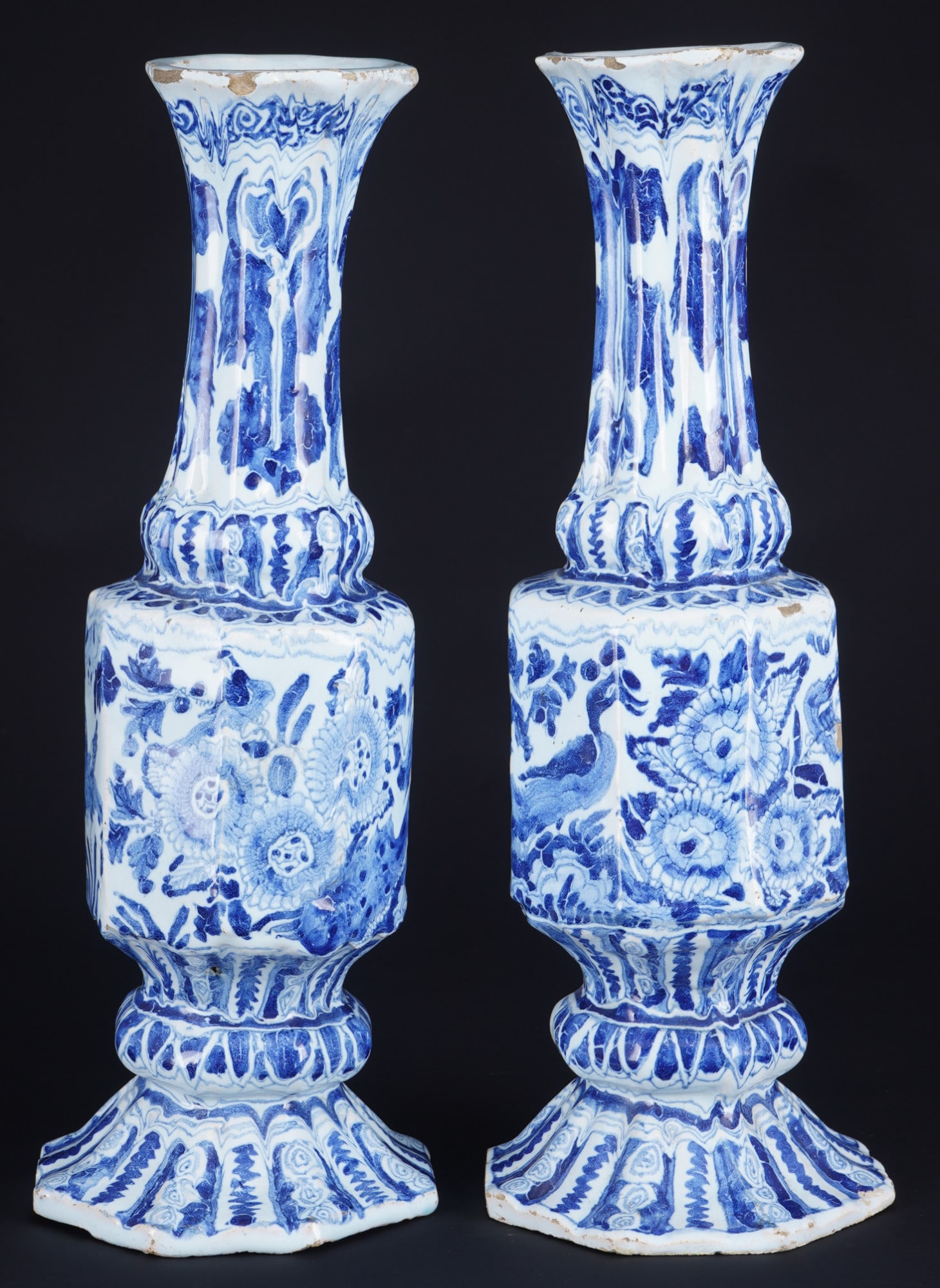 Gerhard Wolbeer, pair of faience vases, early 18th century: Pair of Gerhard Wolbeer Berlin faience vases in bottle form with rock and bird decoration, as well as a peacock, unmarked, early 18th century, each approximately 27.8/28 cm high x 9.7 cm wide at the b