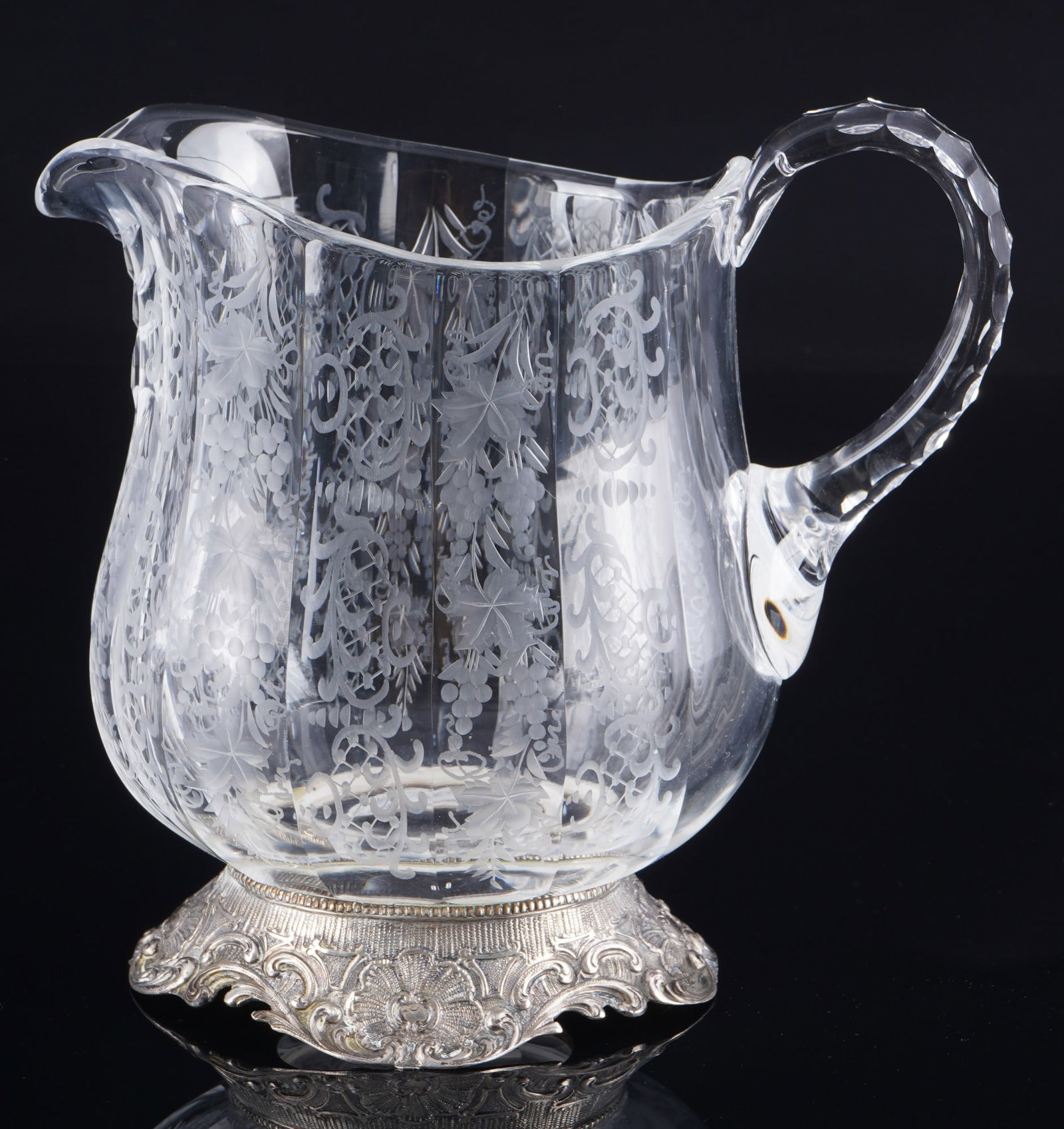 800 silver jug/pitcher, probably Hanau, J. D. Schleissner & Sons,: glass with 800/000 silver foot, stamped 800 + crescent & crown and maker's mark J. D. Schleissner Soehne, Hanau (probably), with grape and vine leaf decoration, volute-decorated silver base, H 22 cm x