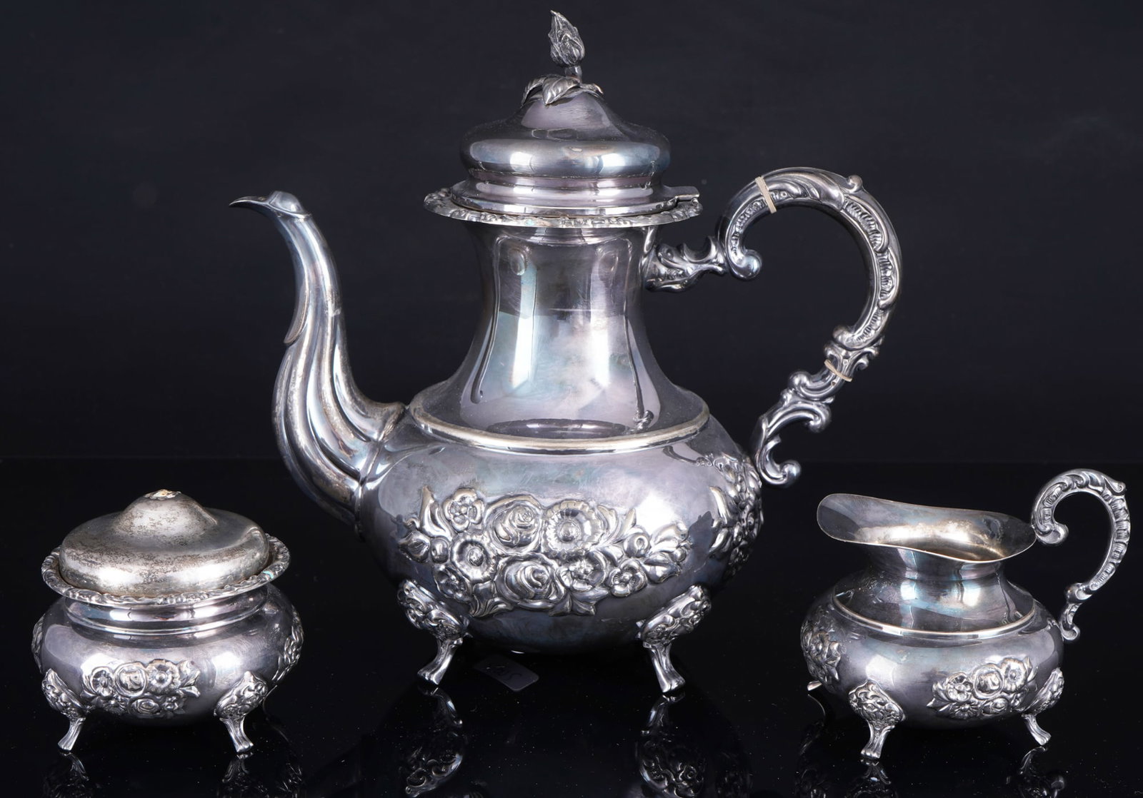 925 silver coffee service,: 925 sterling silver, stamped 925 + crescent moon and crown + Sterling, three-piece coffee service consisting of a coffee pot, creamer, and sugar bowl, each on a small foot. Richly decorated in relief