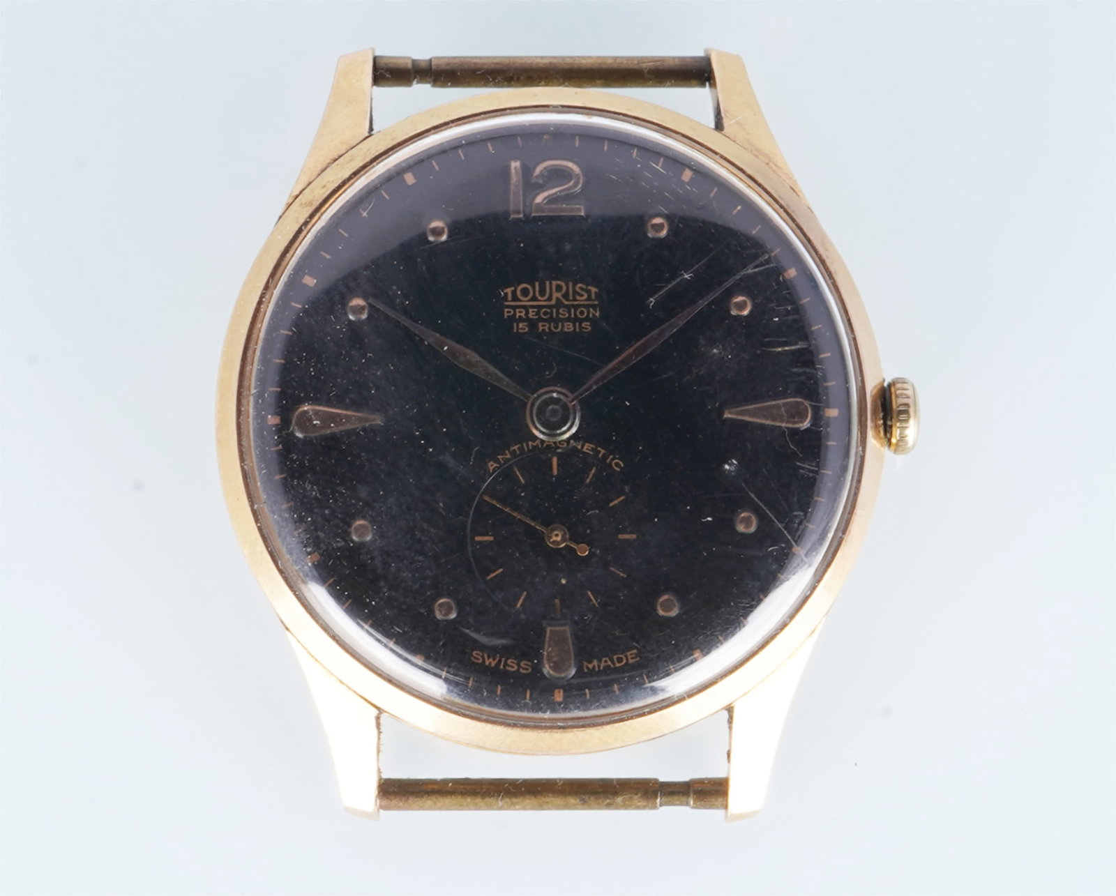 Tourist Precision 750 Gold Men's Wristwatch: 18K yellow gold (GG 750), stamped 18K 0.750 123 2702 15, mechanical movement, hand-wound, 18K yellow gold case, black dial, 35.7 mm wide x 41.8 mm high, weight 30.8 grams, movement runs but sold witho