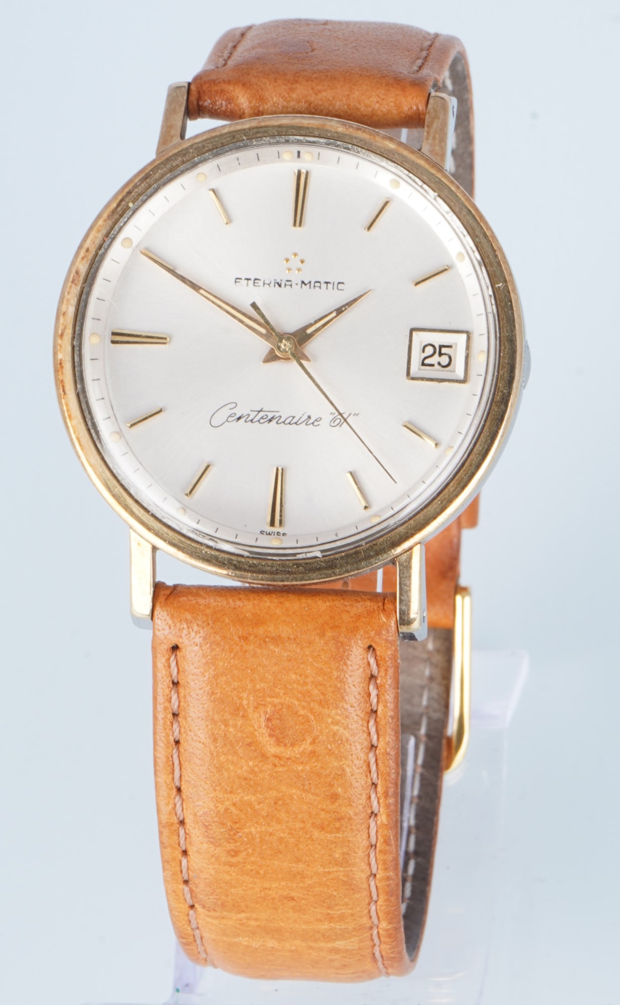Eterna Matic Centenaire 61 Automatic Men's Wristwatch: Stainless steel case, gold-plated cap, circa 1960, model: Centenaire 61 Date, automatic movement, ref. no. 306IVT, no. 4722848, champagne-colored dial, leather strap with pin buckle, H 40 mm x W 35 mm